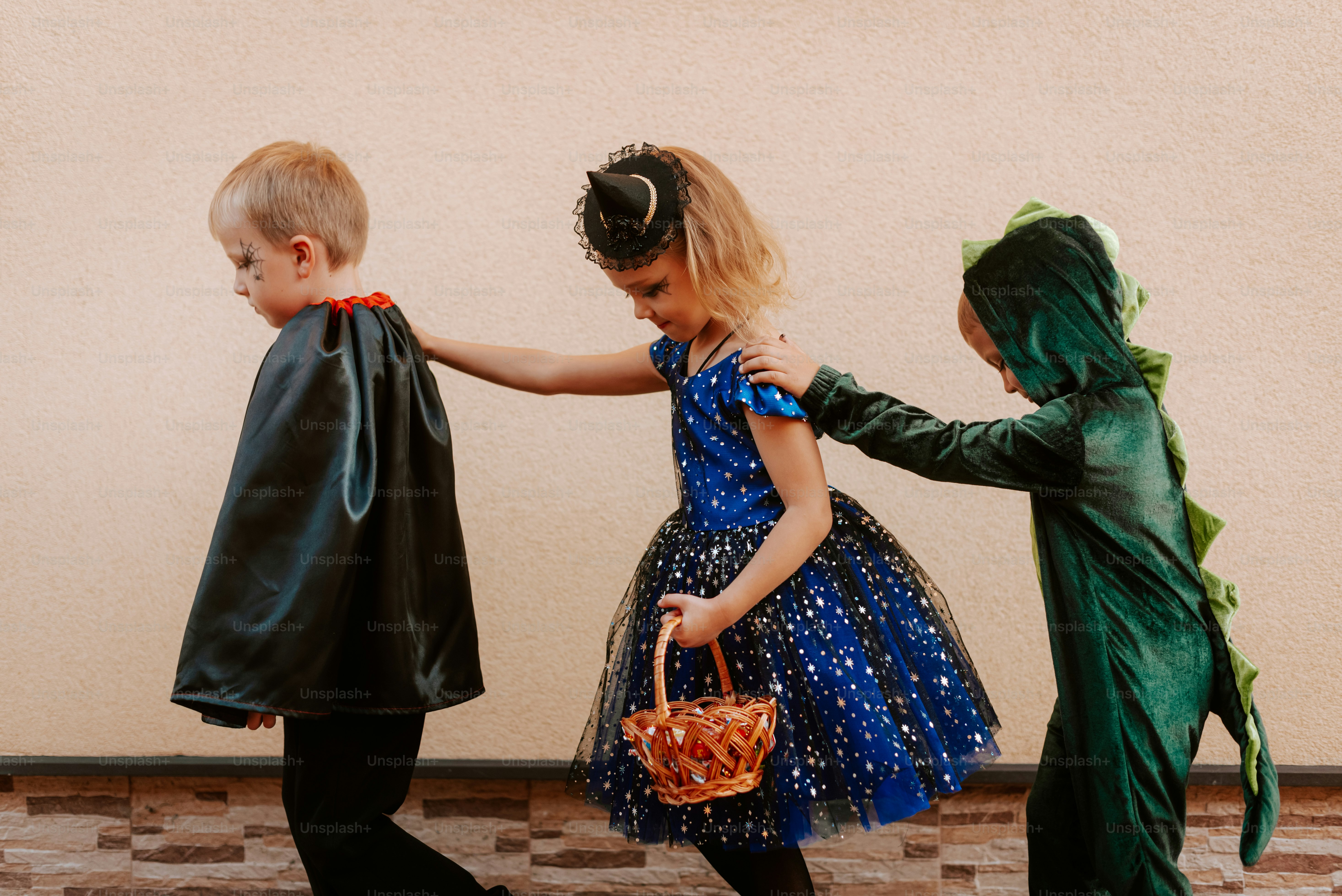 A group of children in costumes standing next to each other