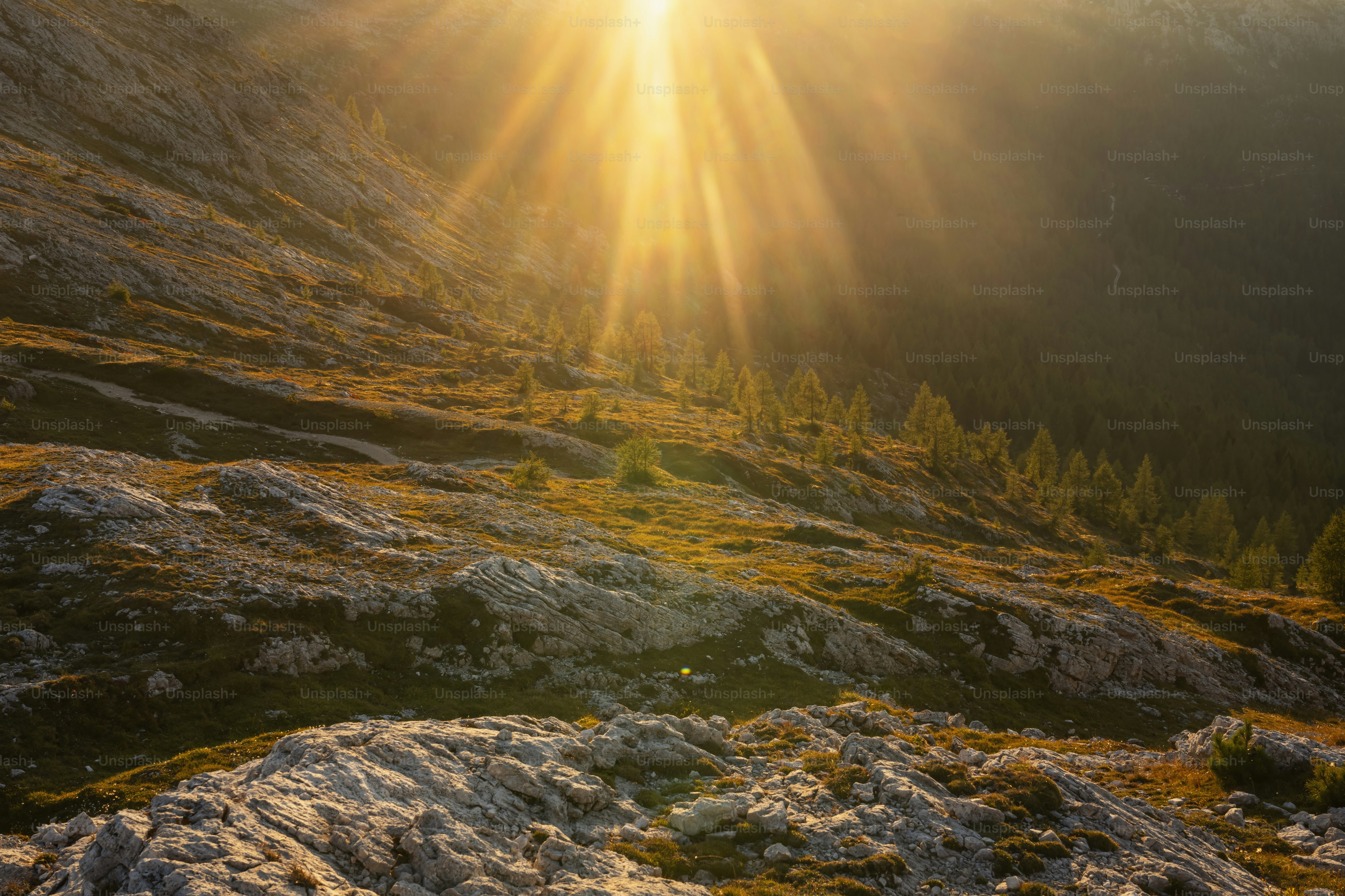 The sun is shining down on the mountains