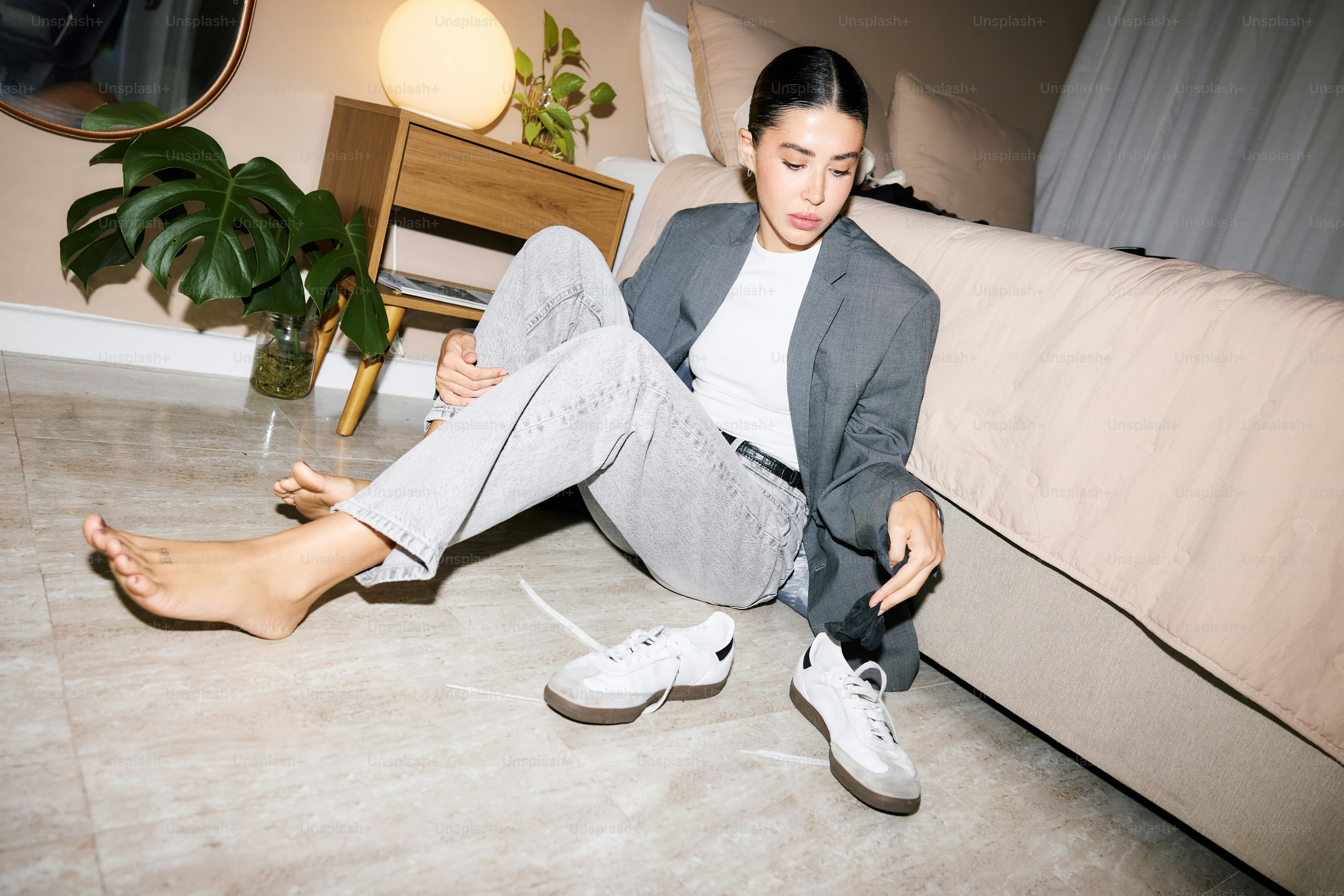 A woman sitting on the floor in a room