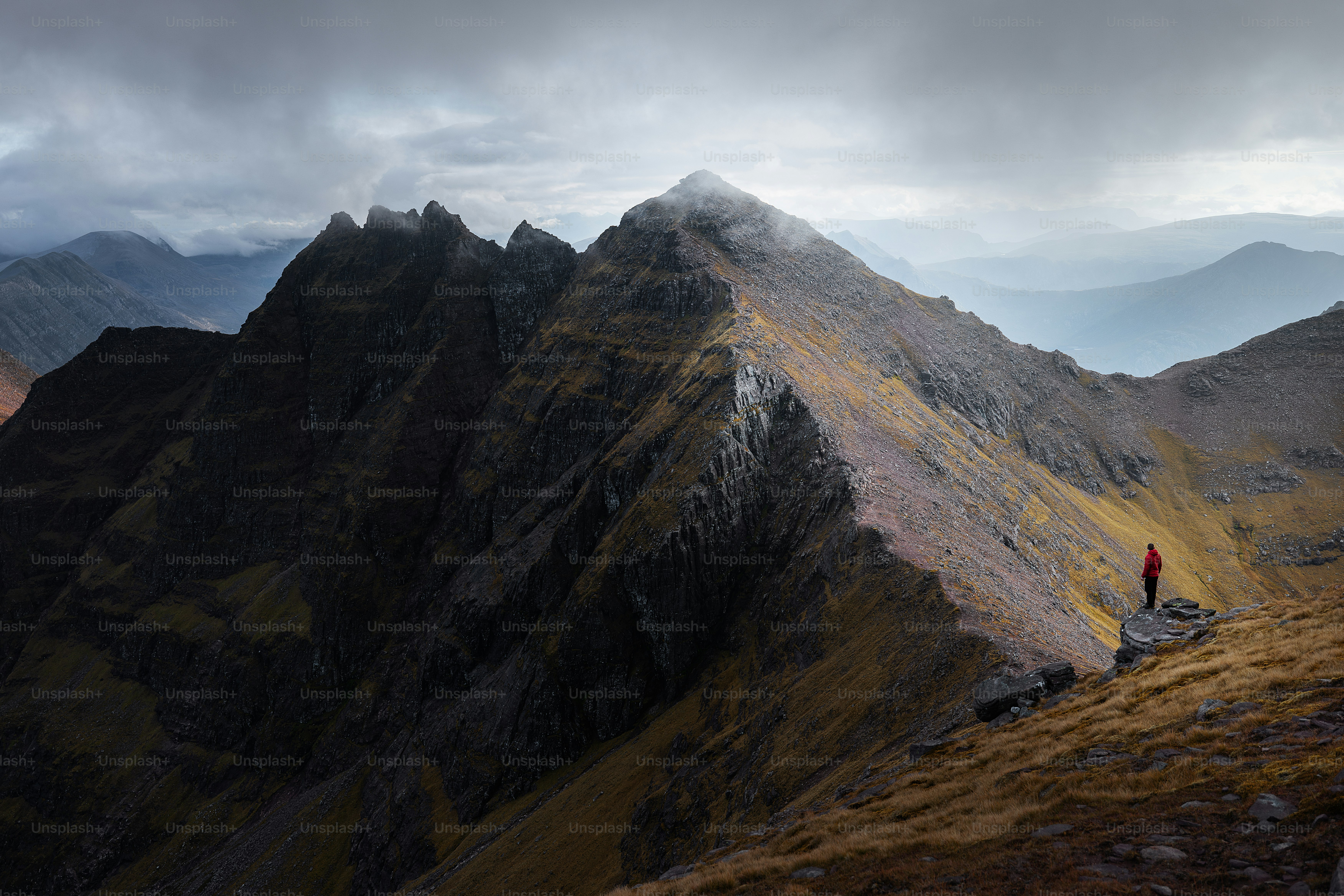 A person standing on top of a mountain