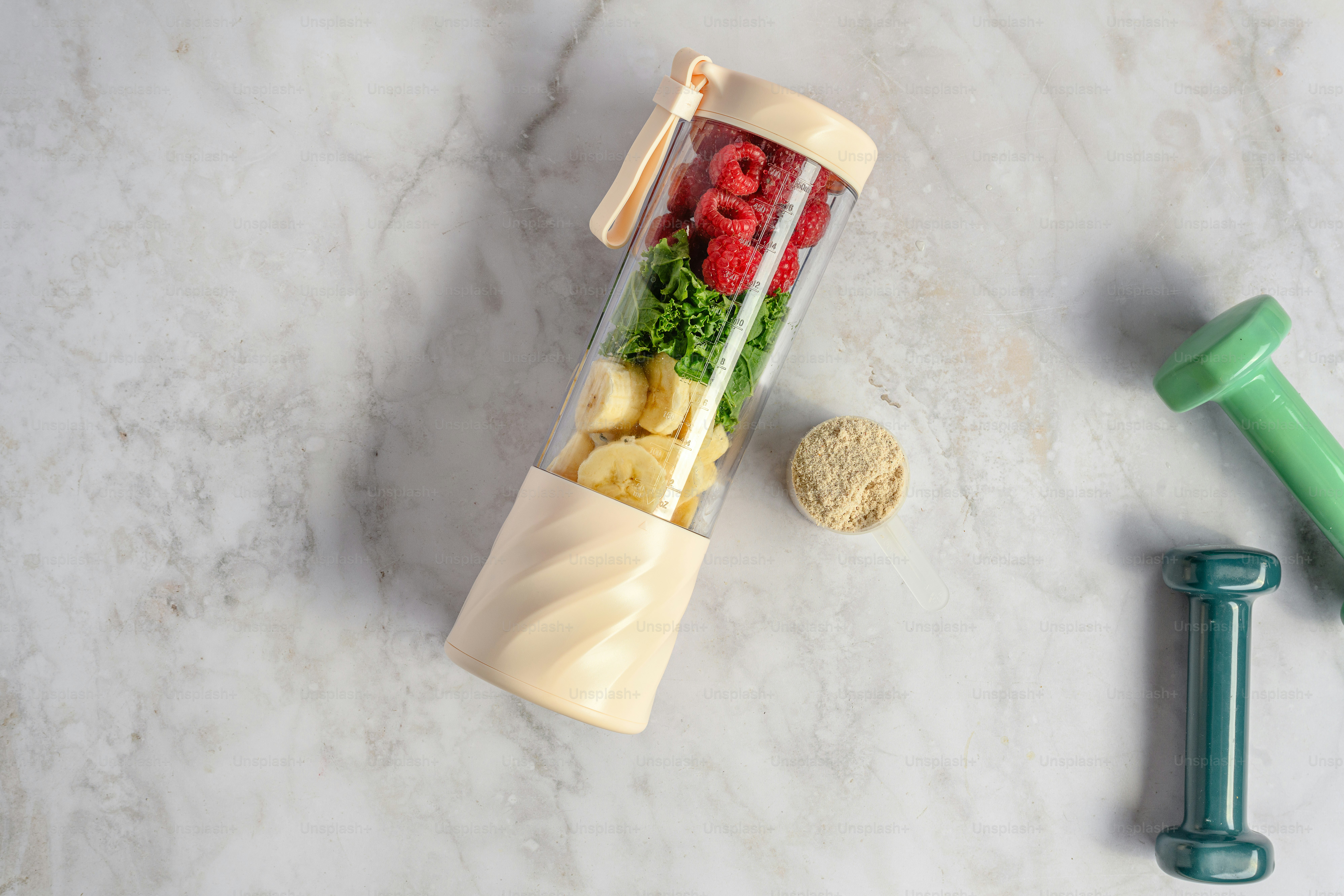 A blender filled with fruits and vegetables on top of a counter