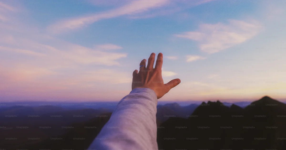 Person Retching A person's hand reaching up into the sky photo – Small person big ...