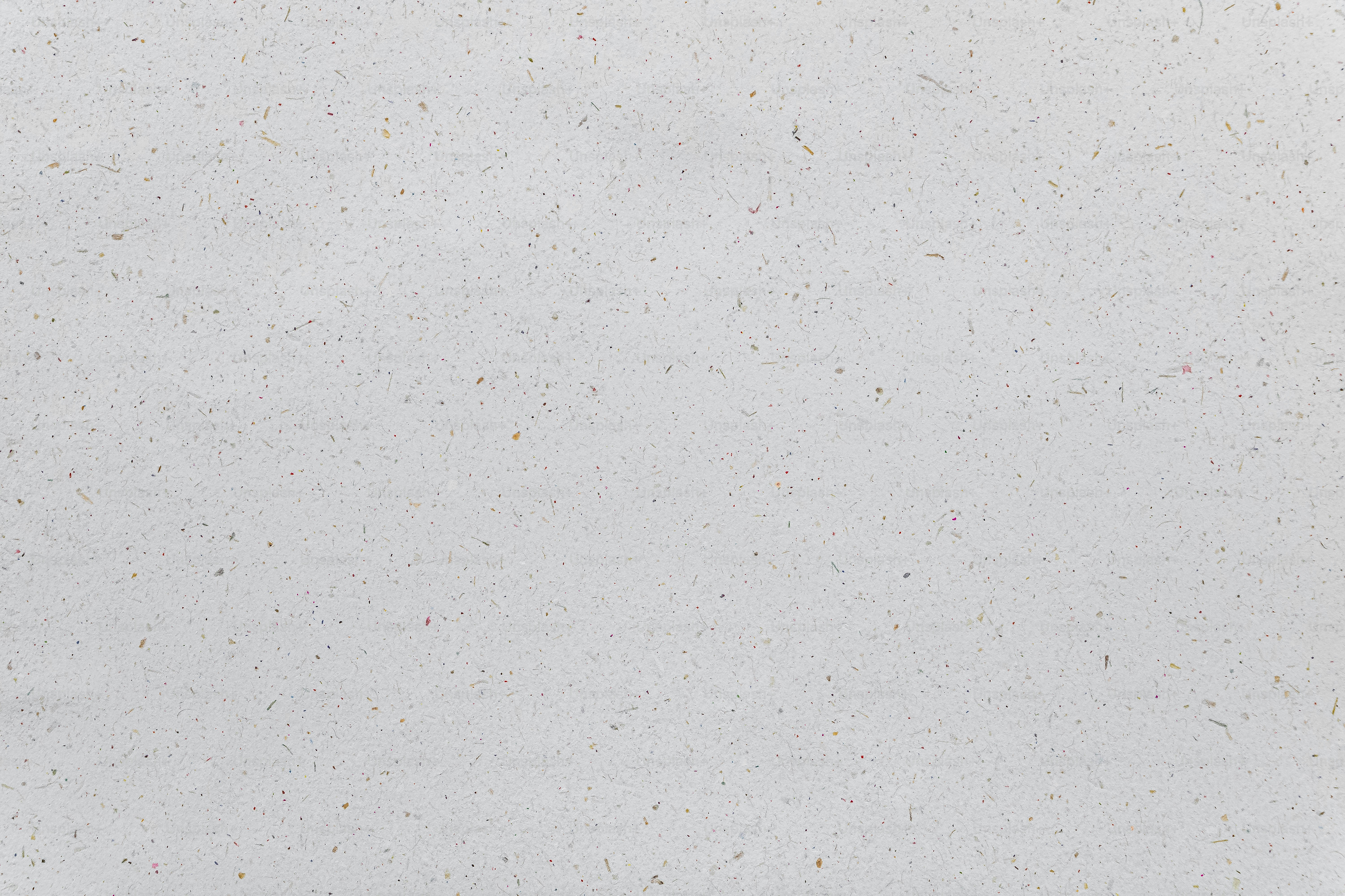 A man riding a snowboard down a snow covered slope