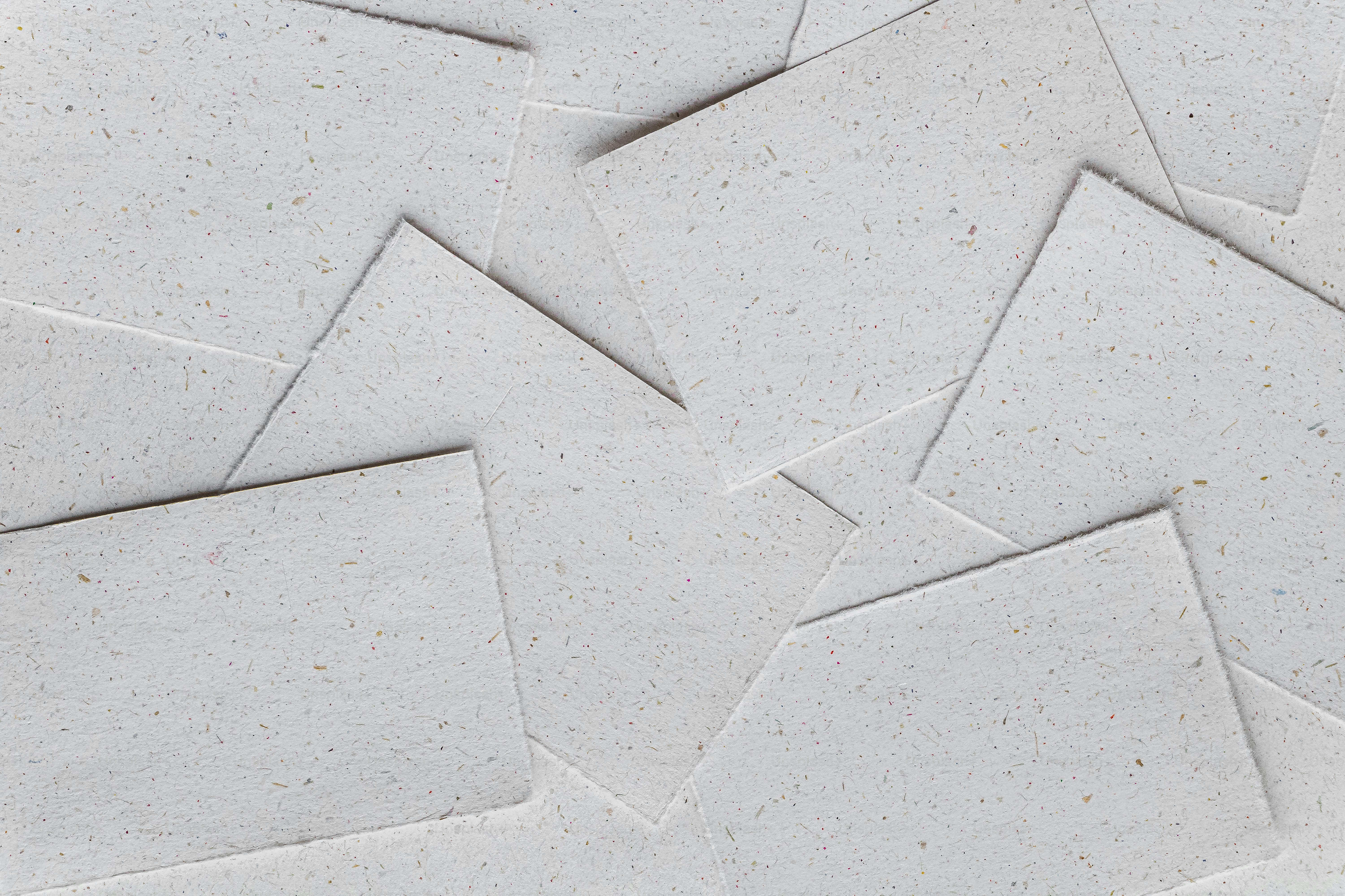 A close up of a white paper with a pattern on it