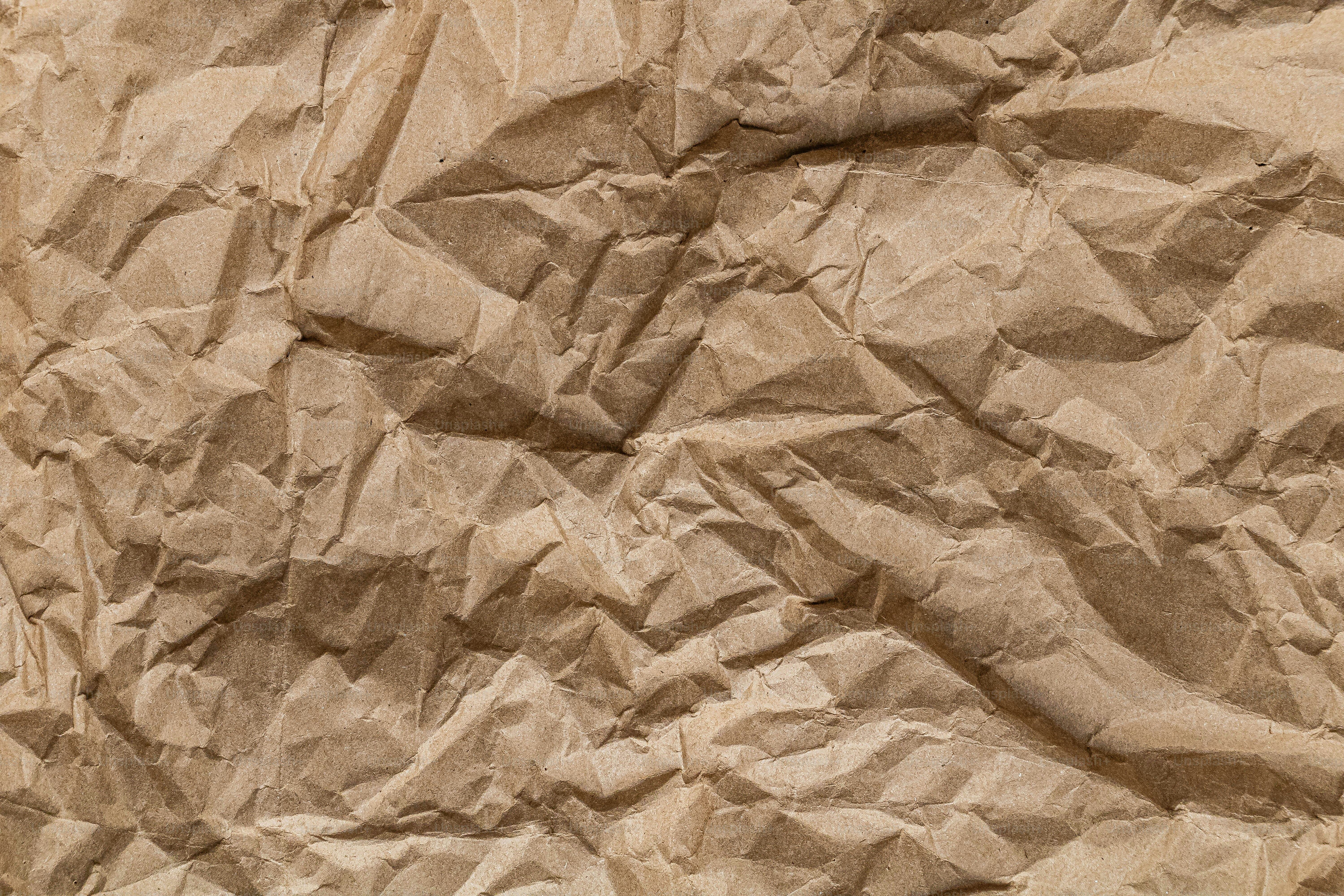 A piece of brown paper that has been wrinkled