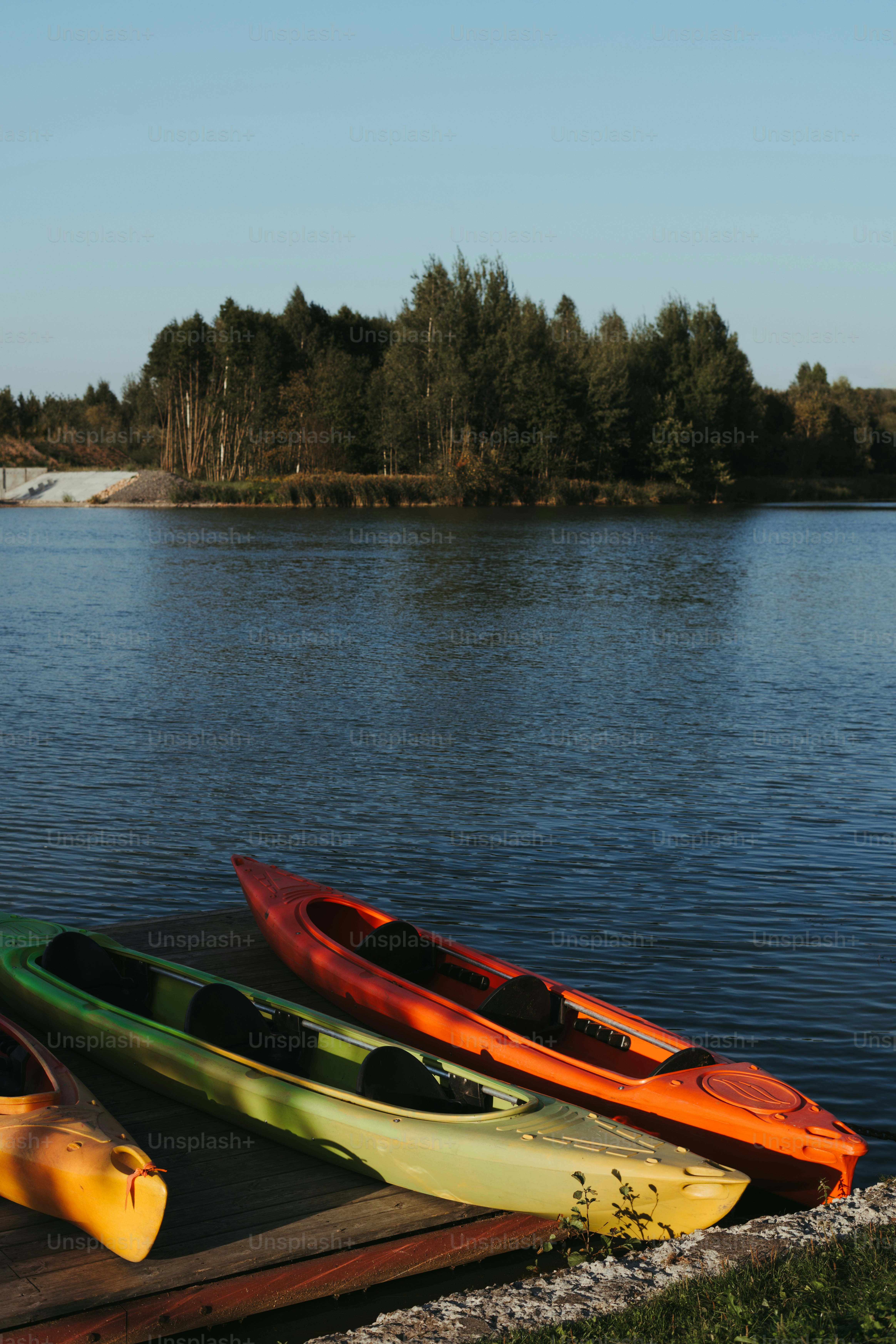 A couple of kayaks sitting on top of a wooden dock