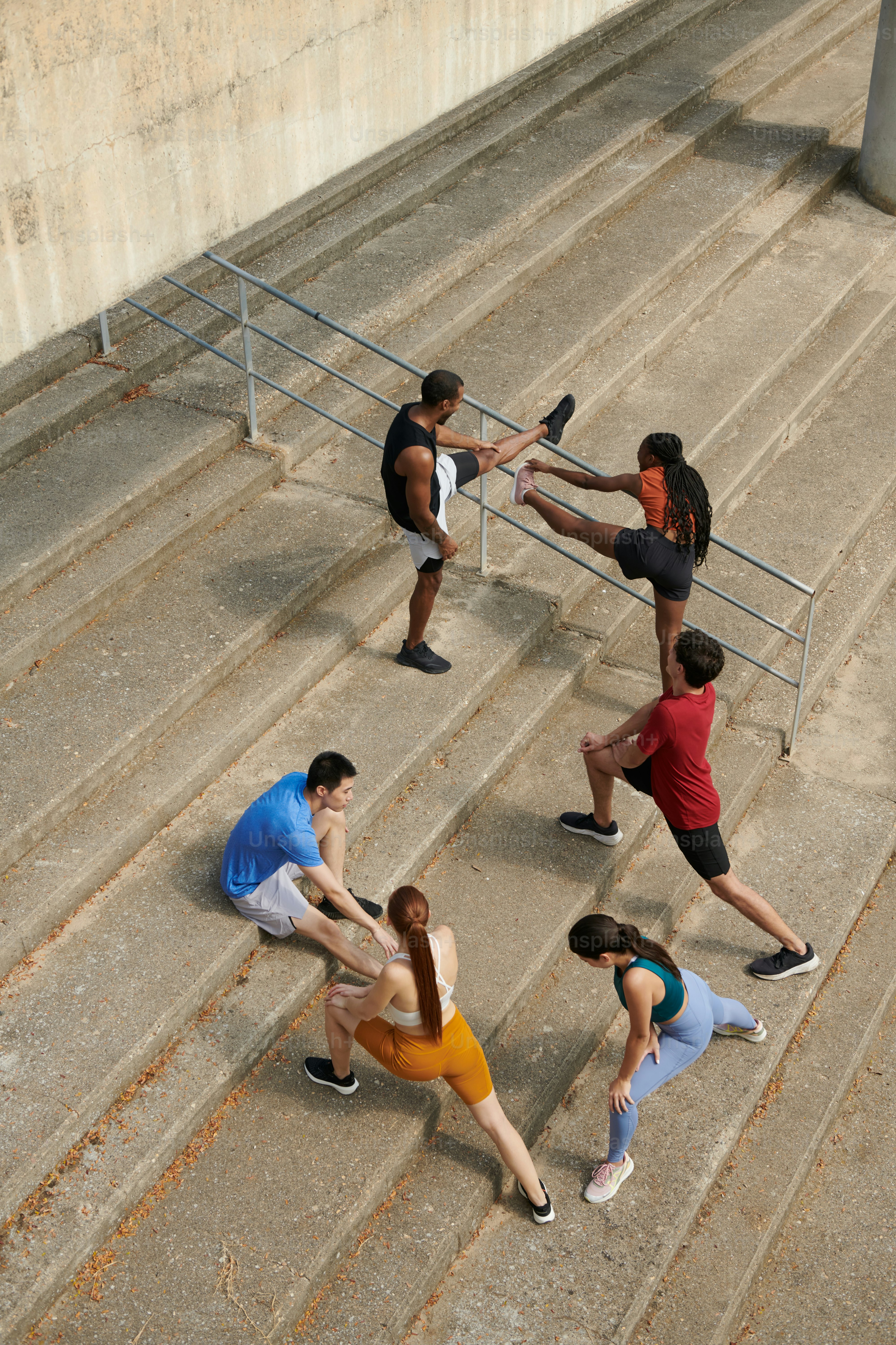 A group of people standing on top of a set of stairs