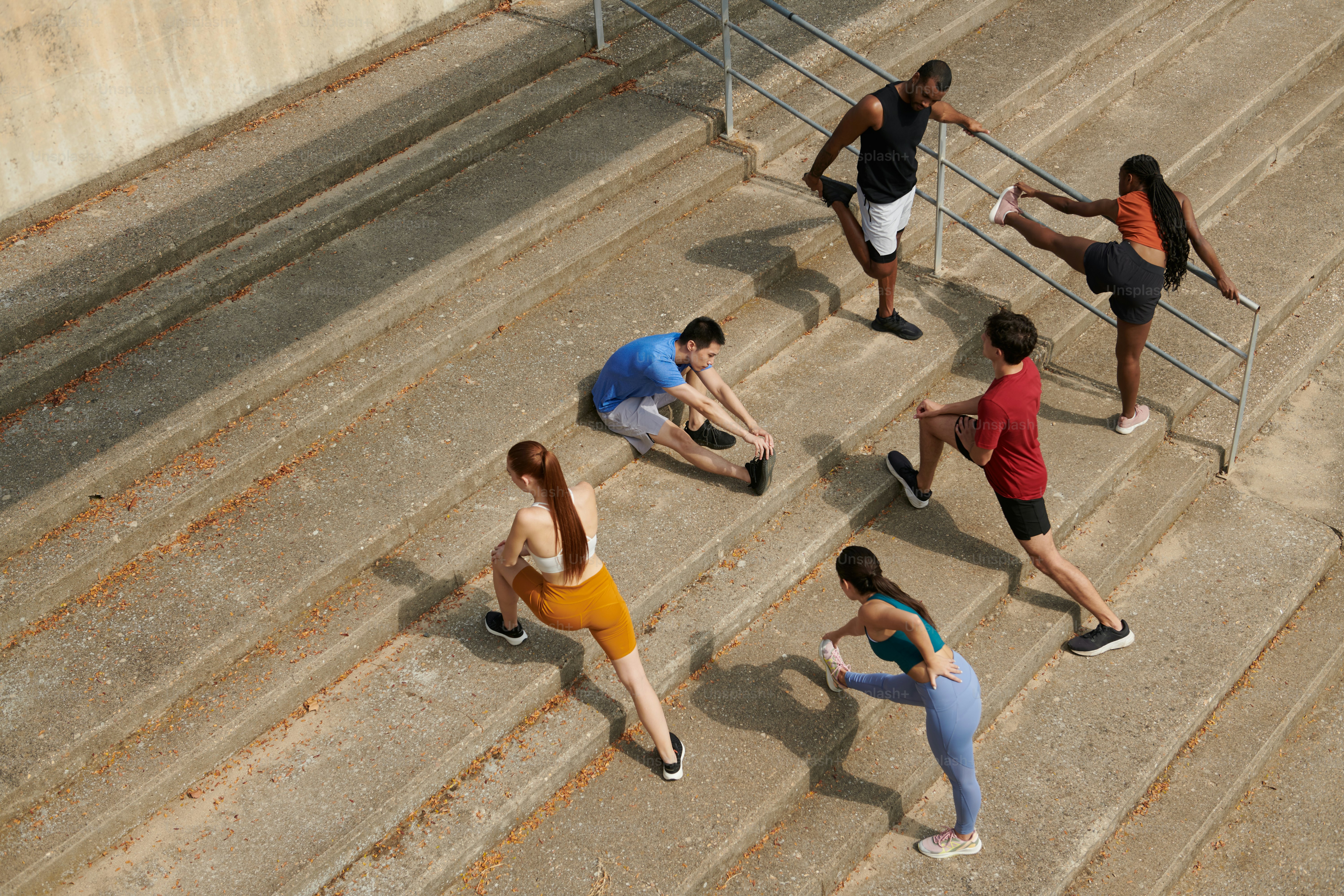 A group of people are running up some stairs