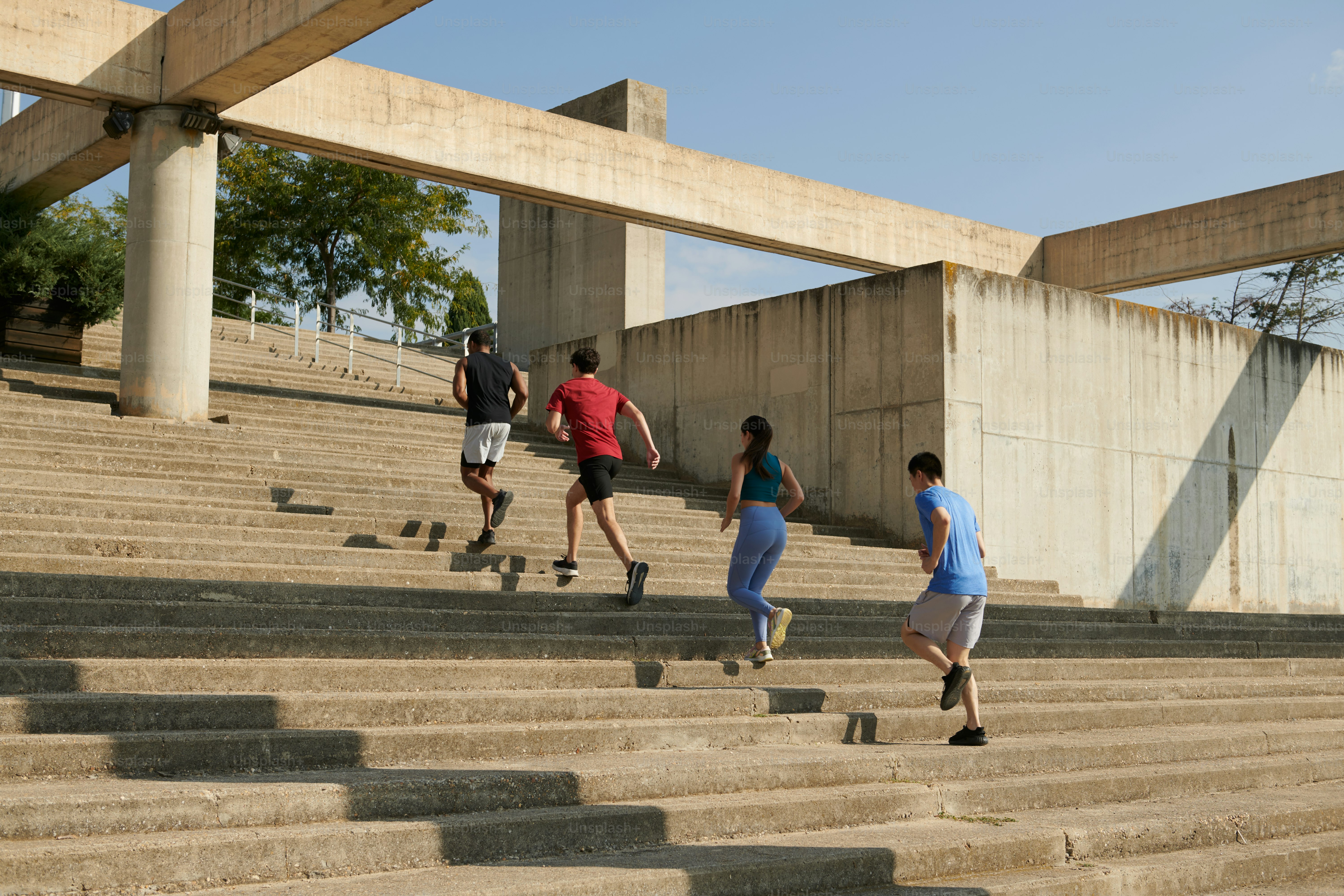 A group of people walking up a flight of stairs