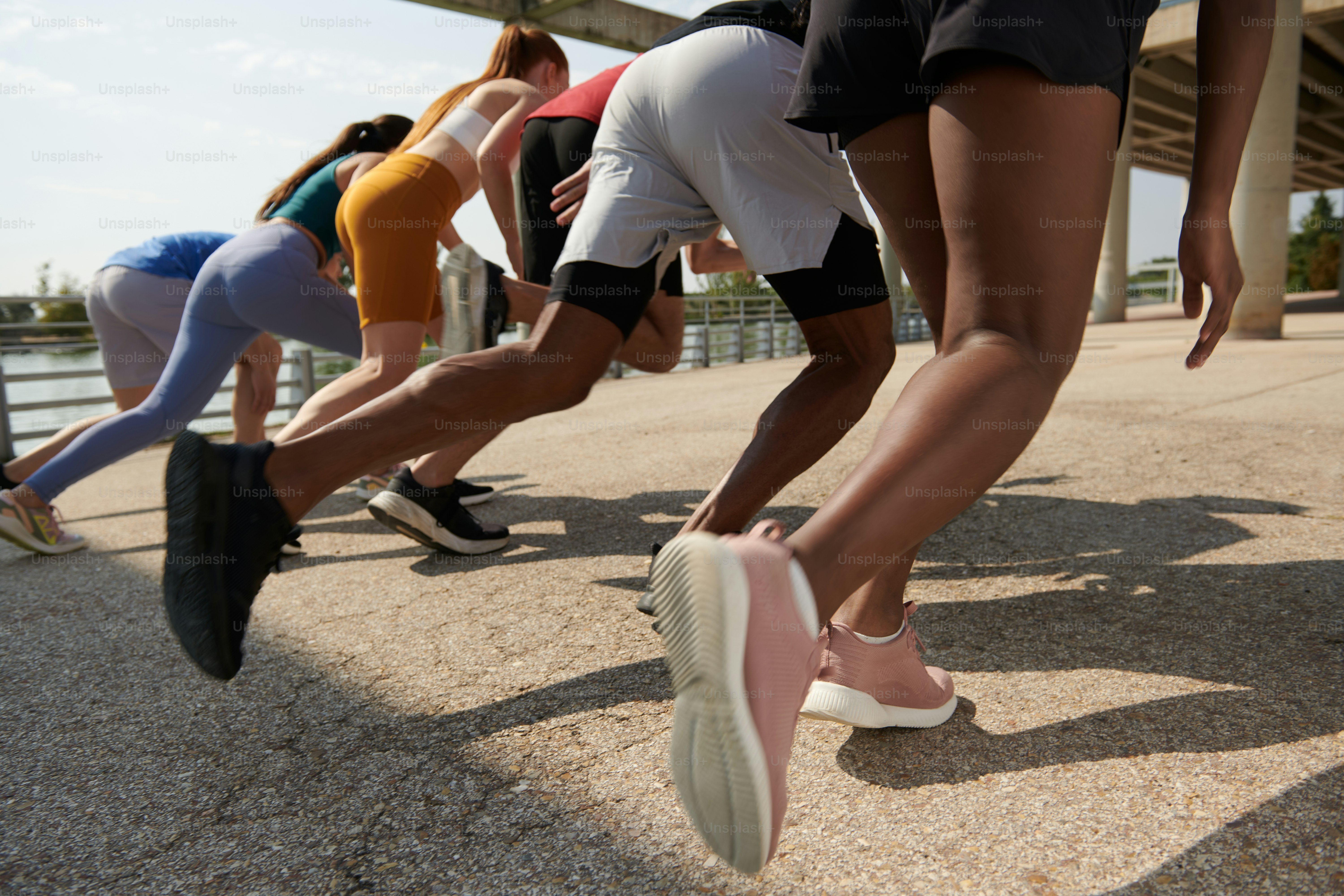 A group of people running on a bridge