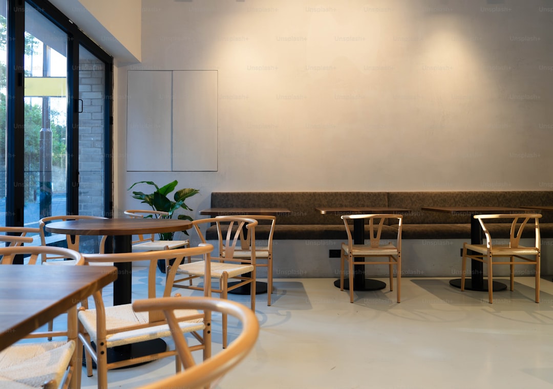 A restaurant with wooden tables and wooden chairs