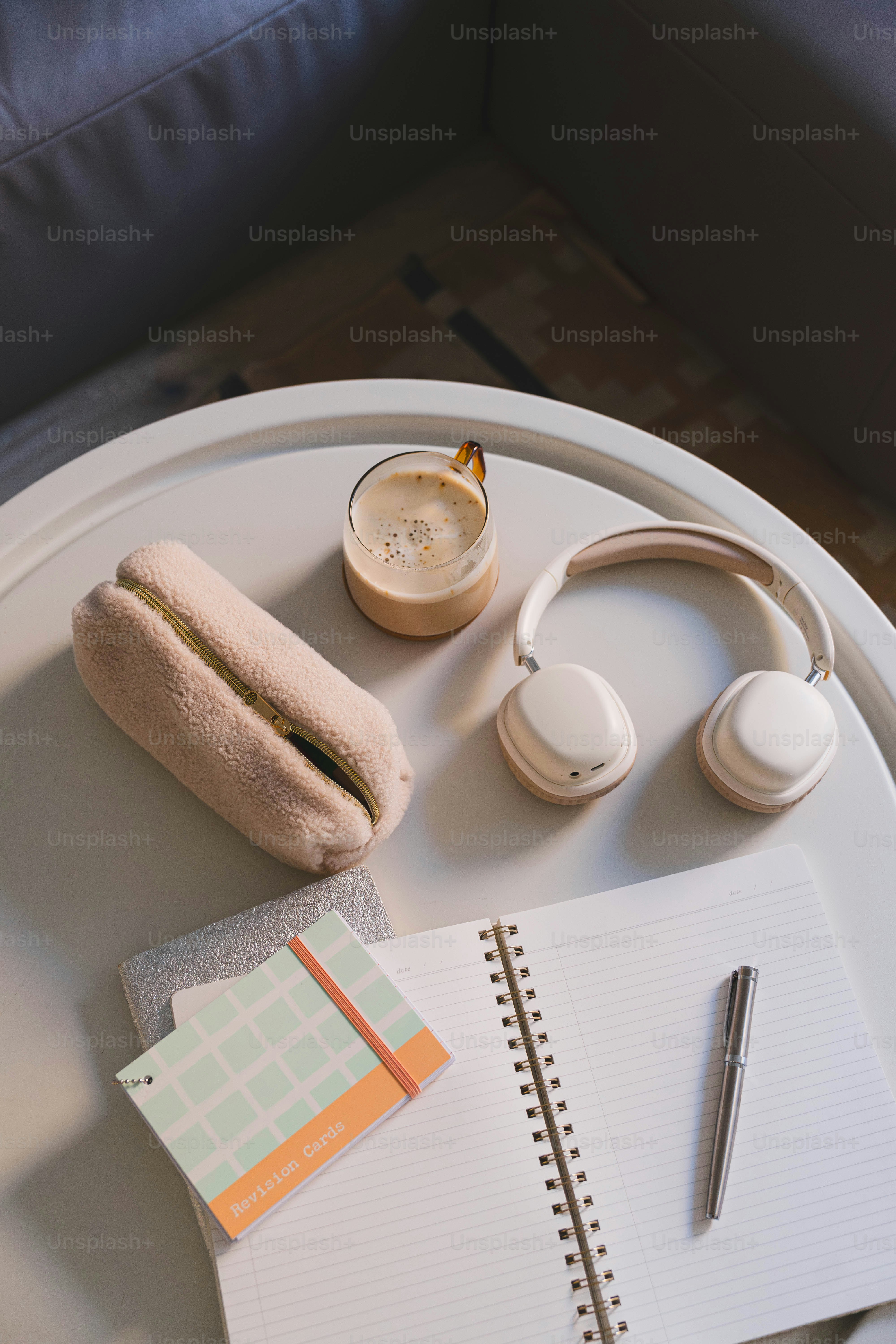 A white tray topped with a hot dog and headphones