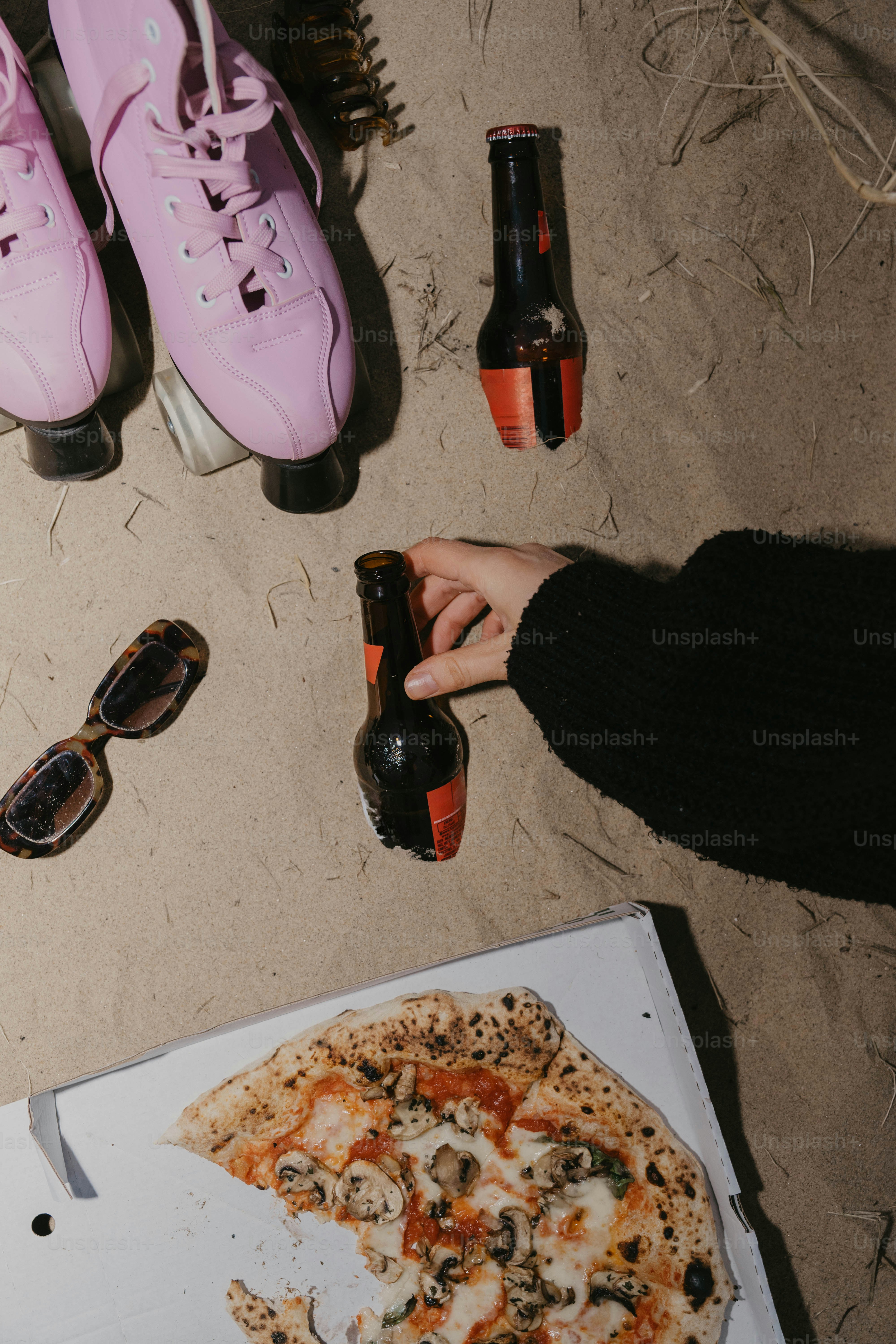 A box of pizza and a pair of pink shoes