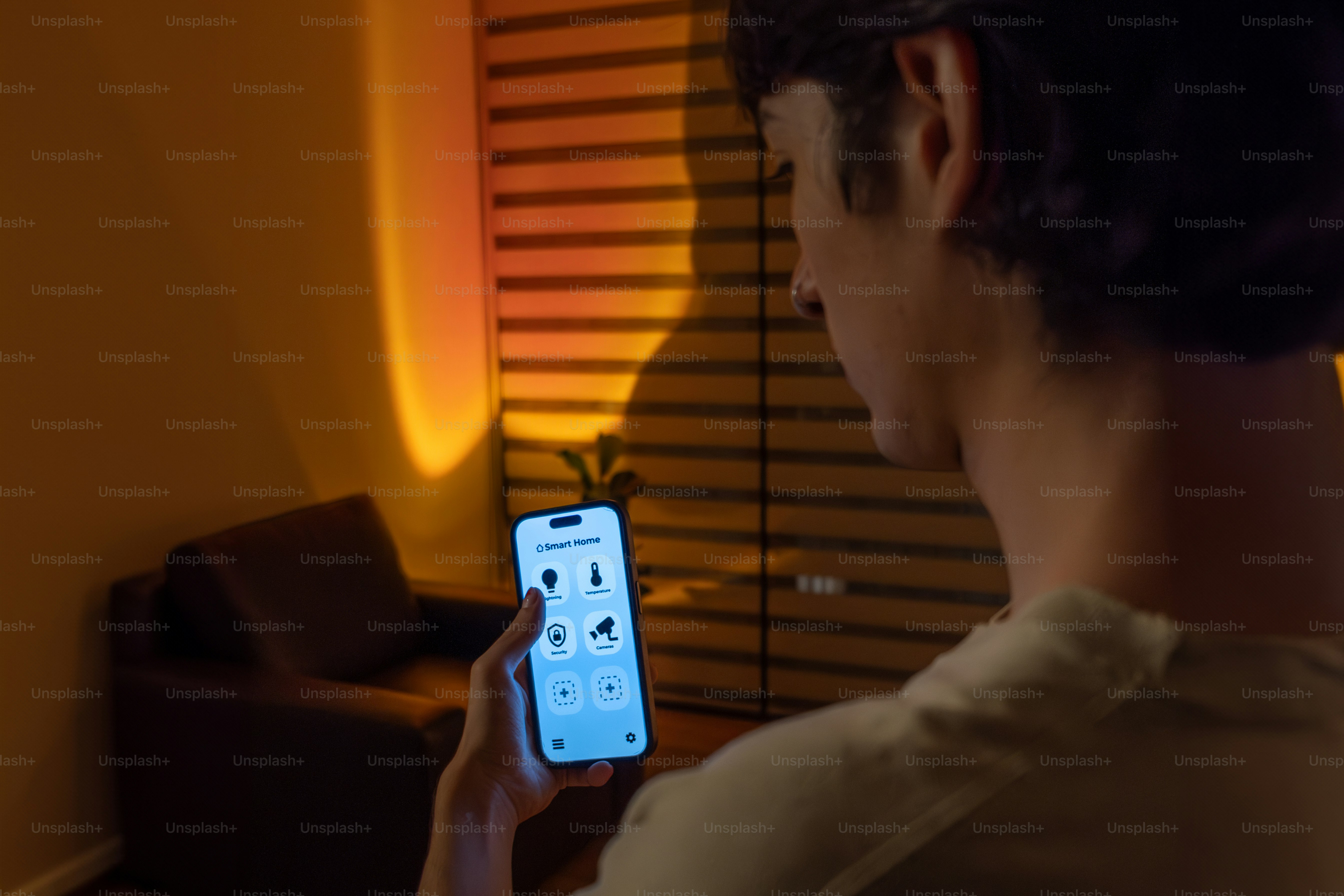 A person holding a cell phone in their hand