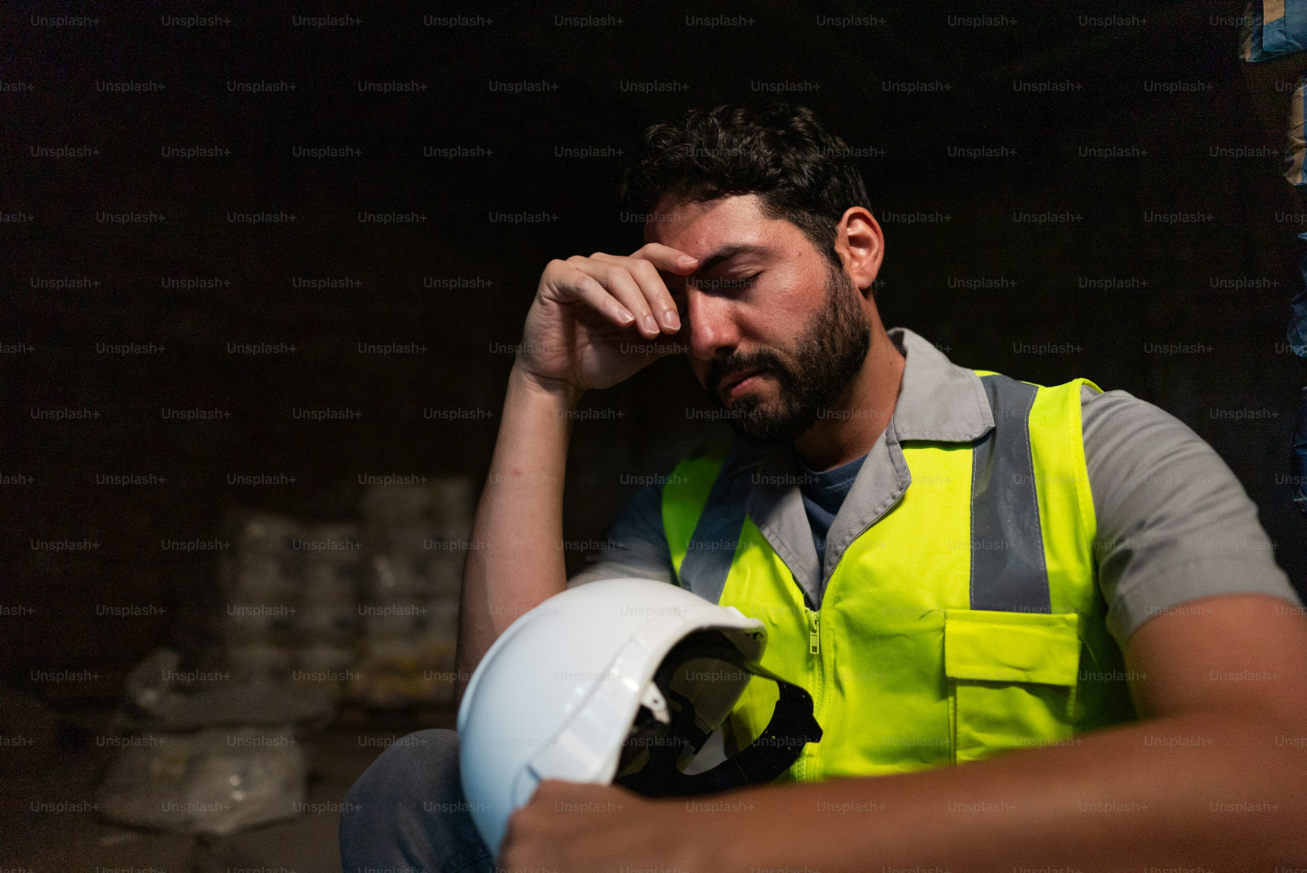 Worried construction worker man at work
