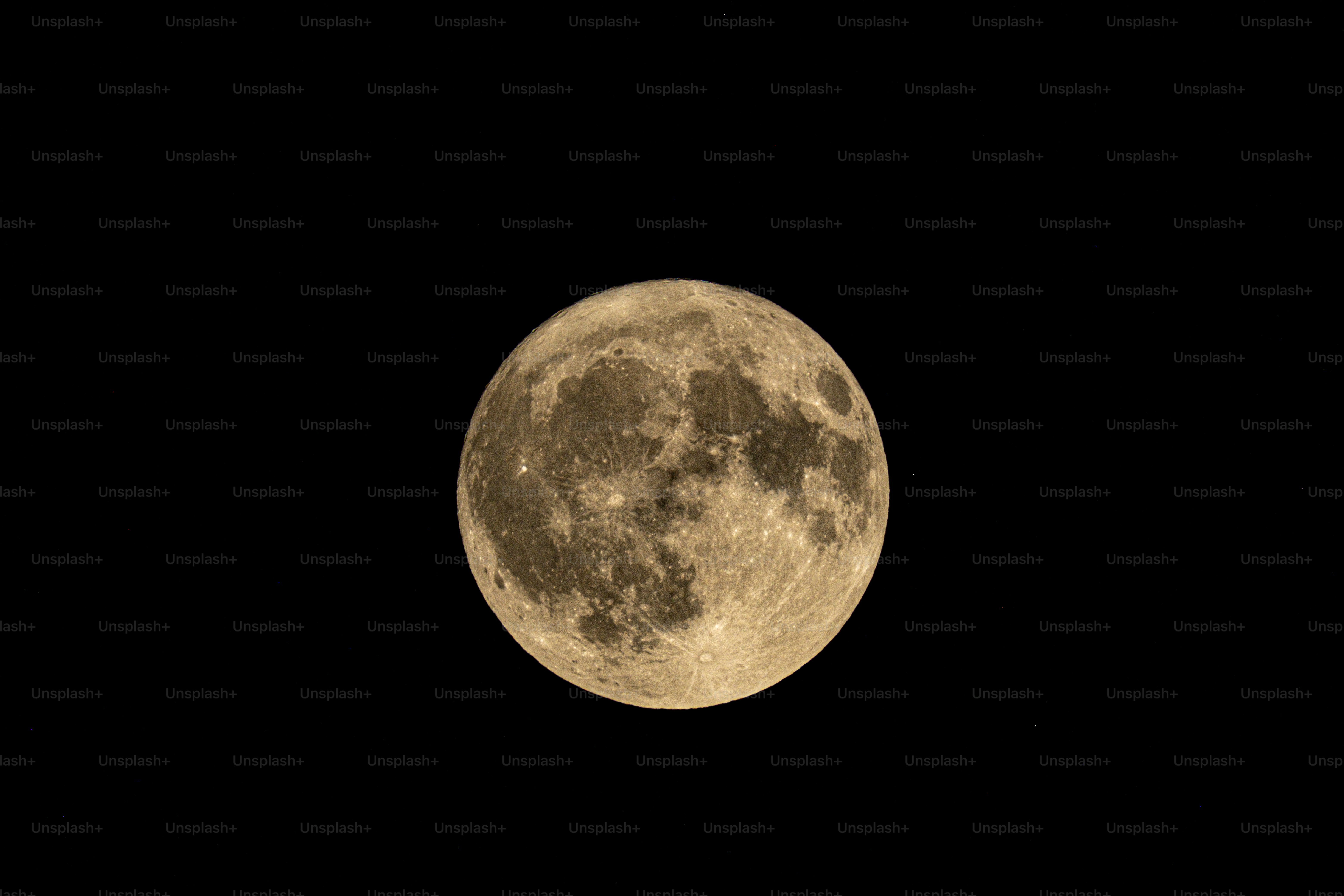 A full moon is seen in the night sky