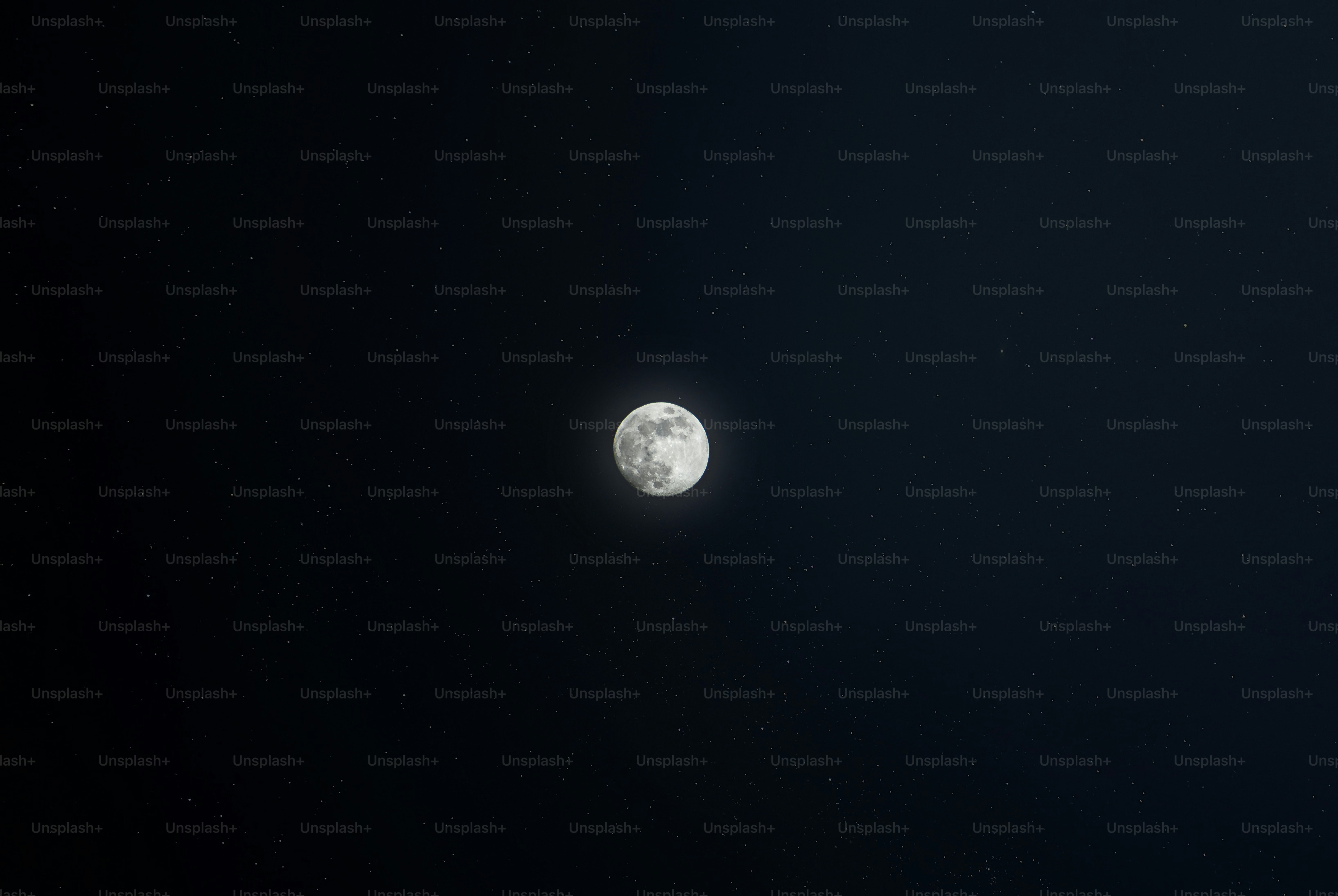 A view of the moon through a telescope lens