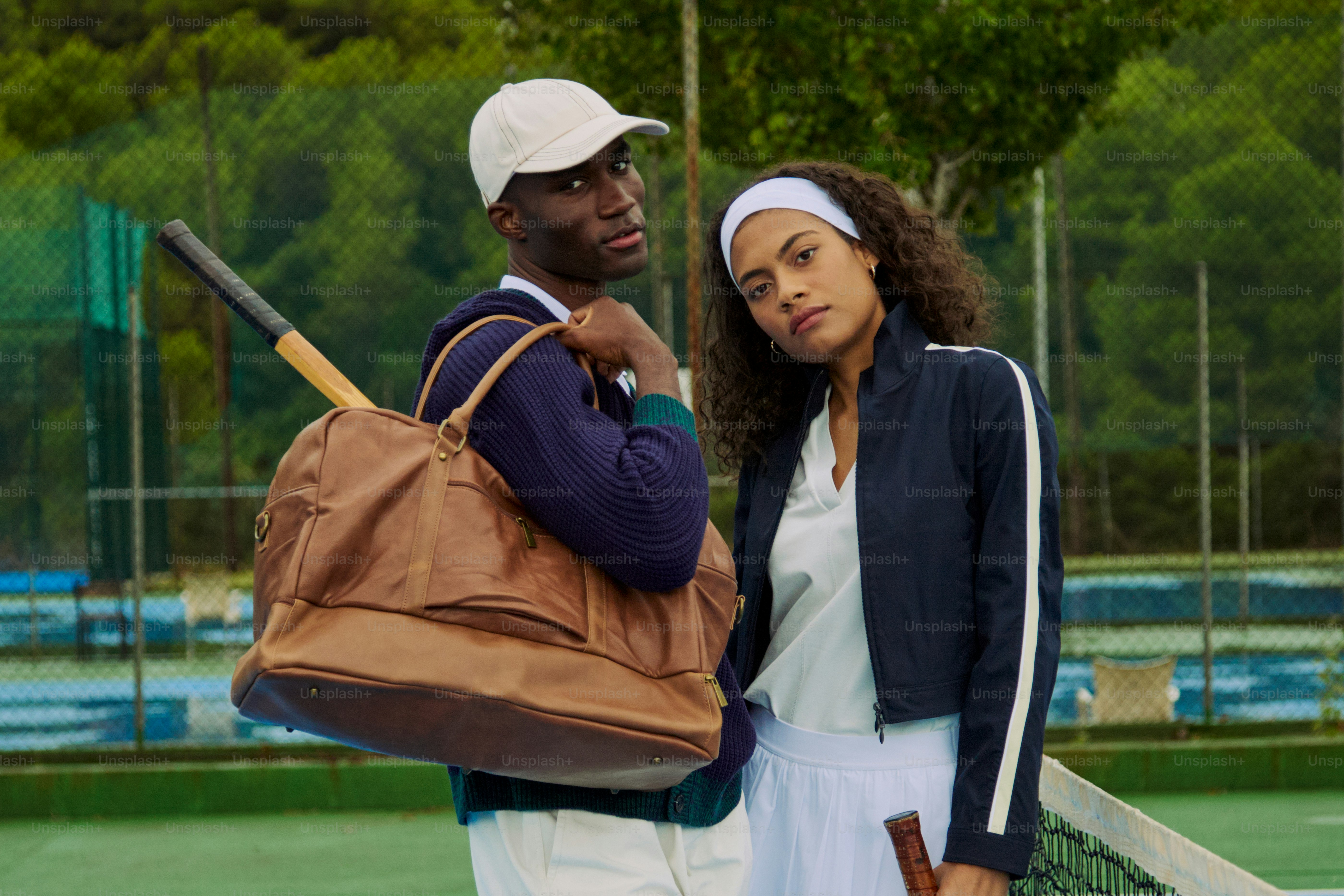 A man and a woman standing on a tennis court