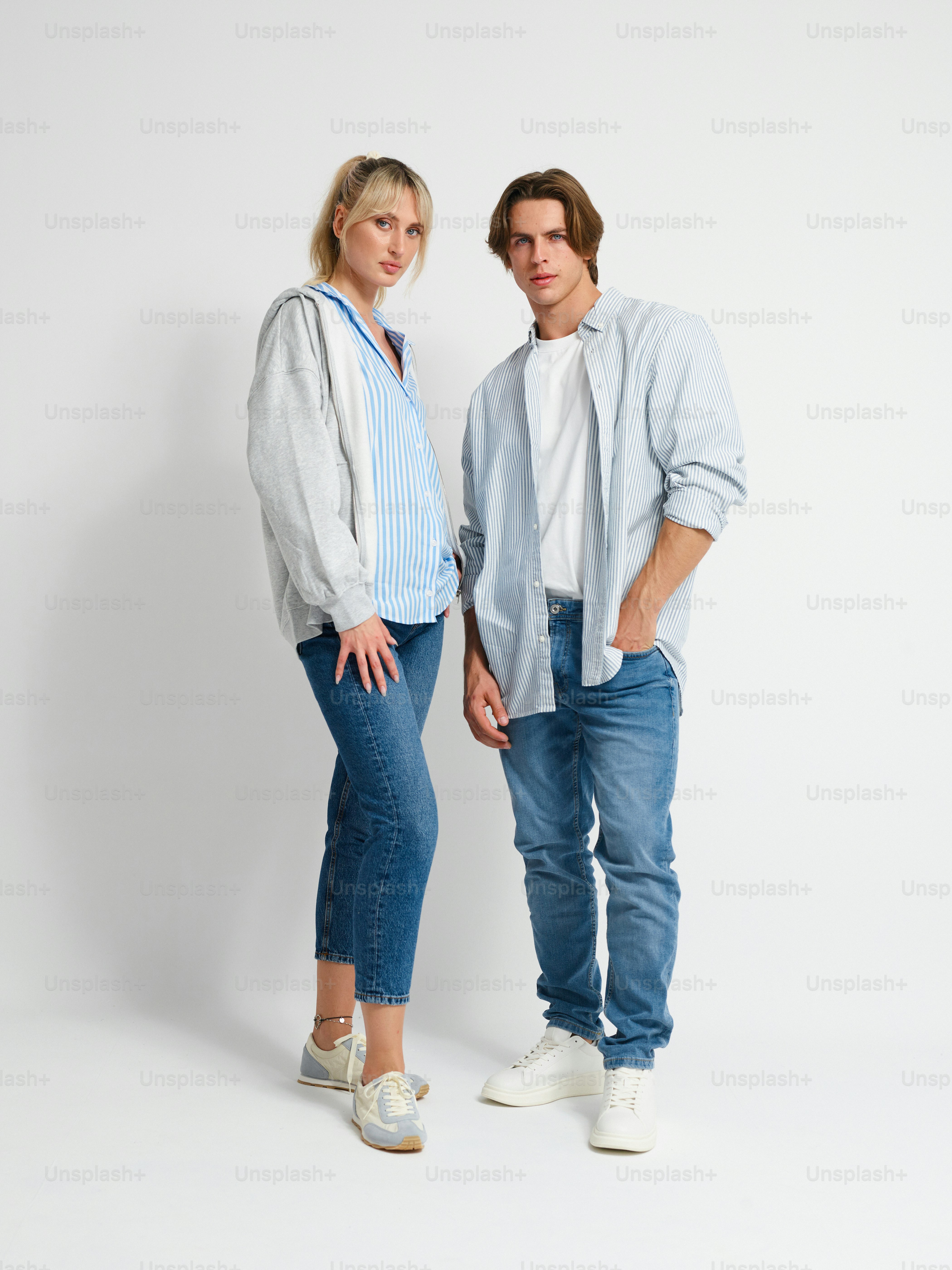 A man and a woman standing next to each other photo – Model Image on ...