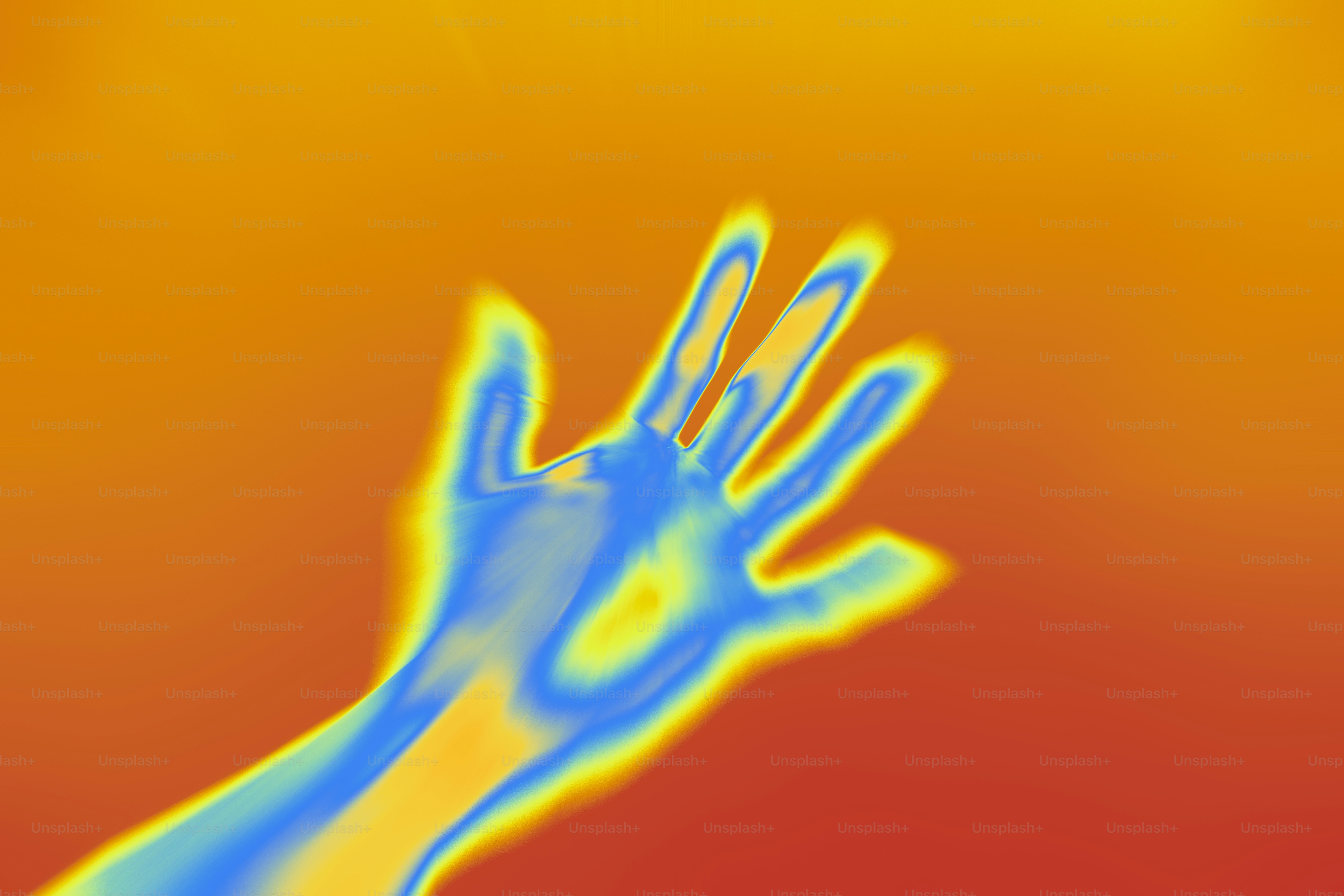 A blurry image of a hand reaching up