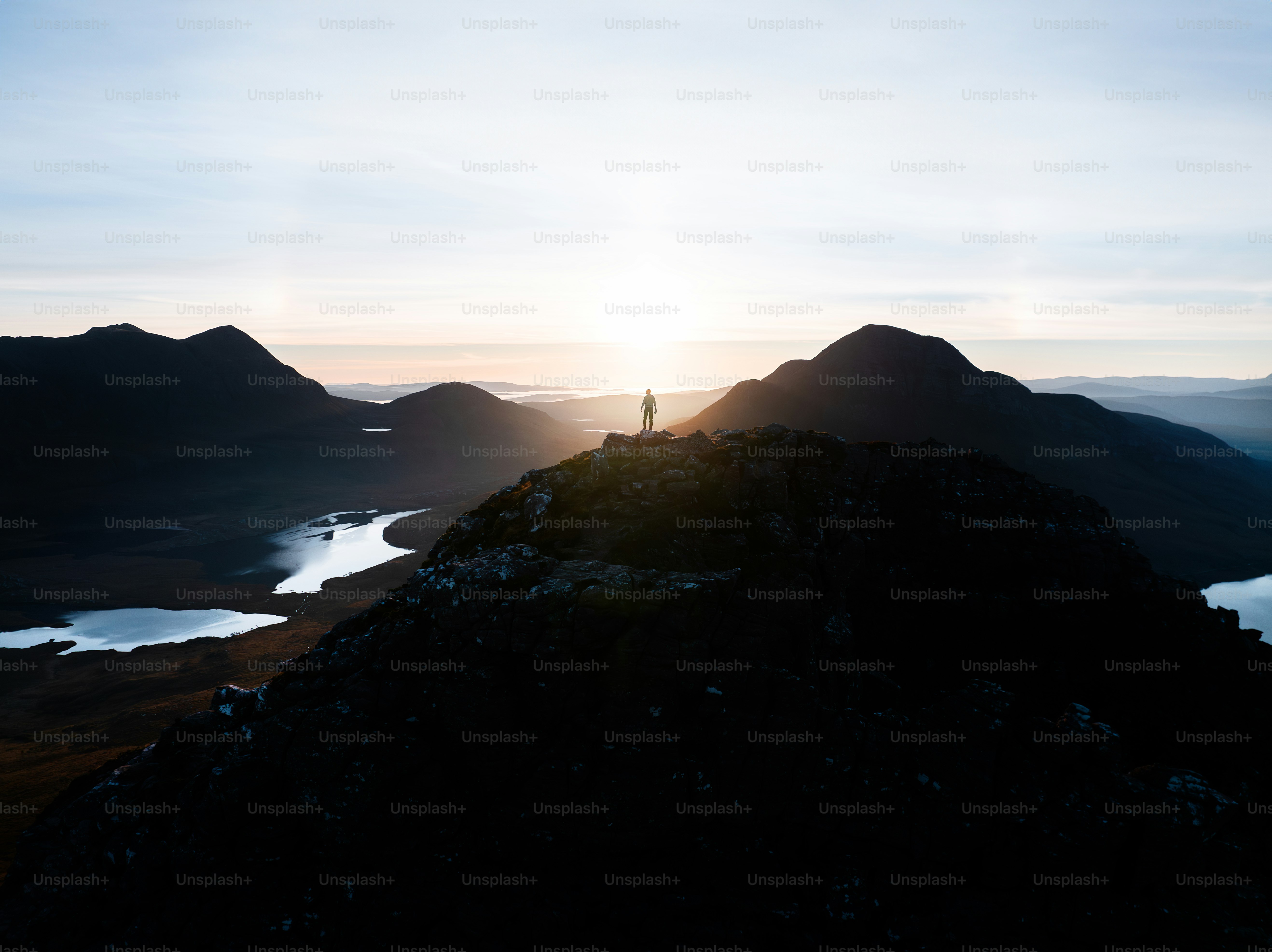 A person standing on top of a mountain
