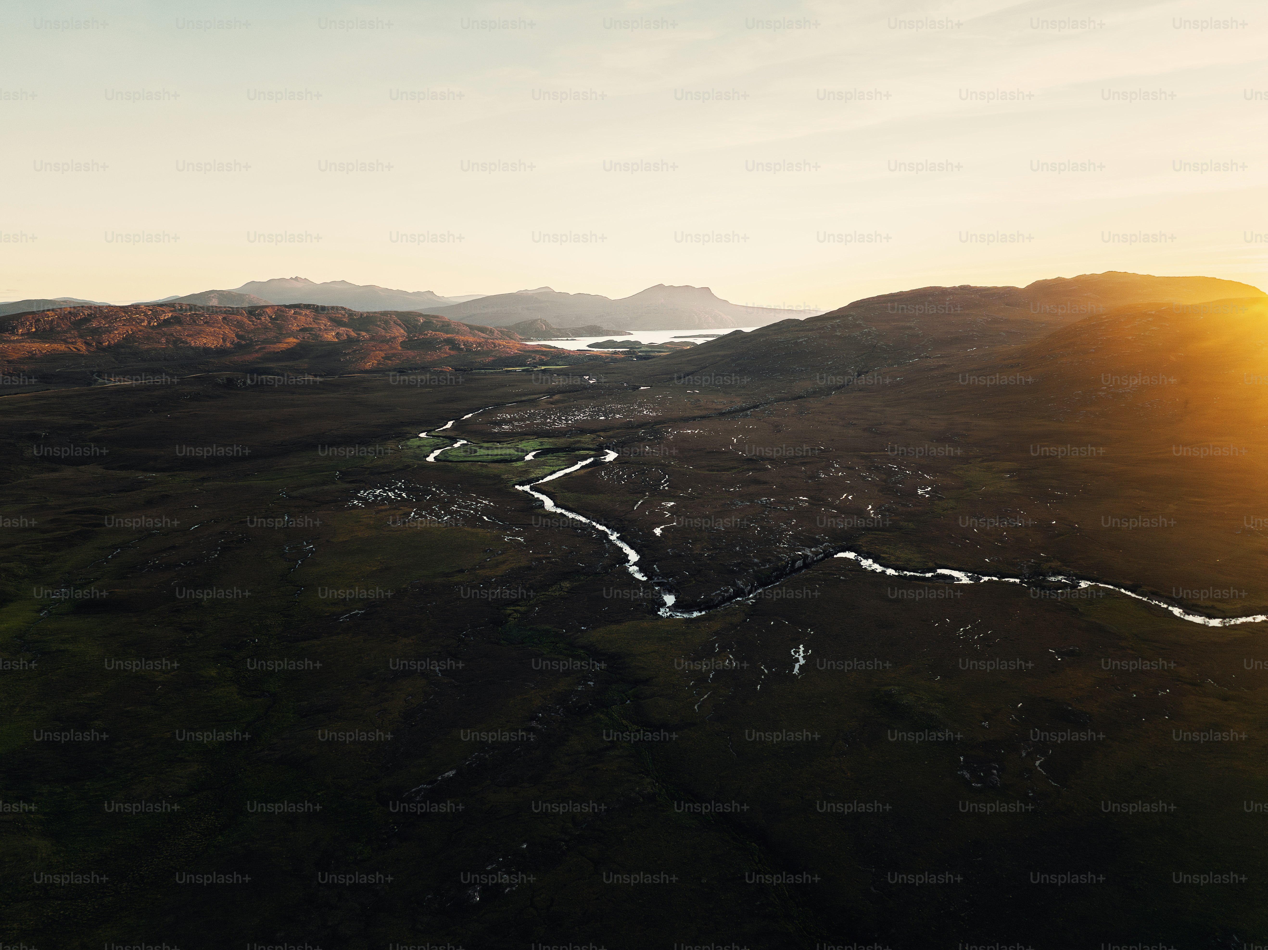 An aerial view of a valley with a river running through it
