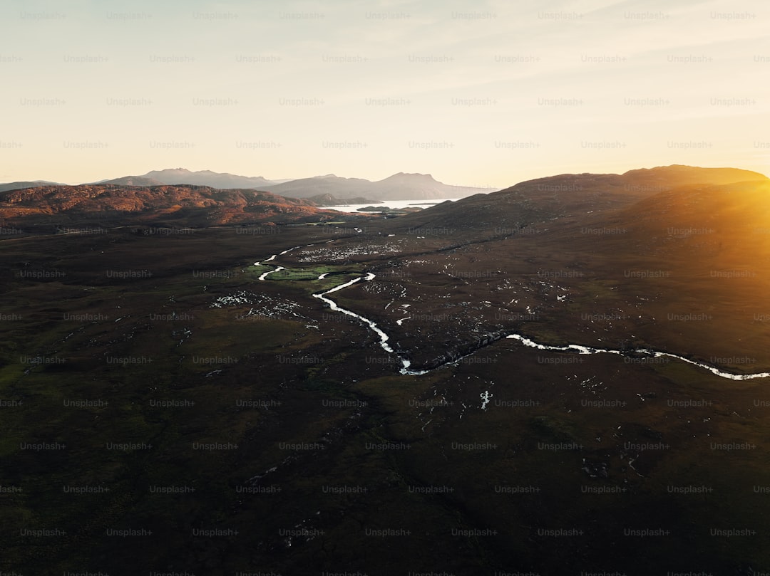 An aerial view of a valley with a river running through it