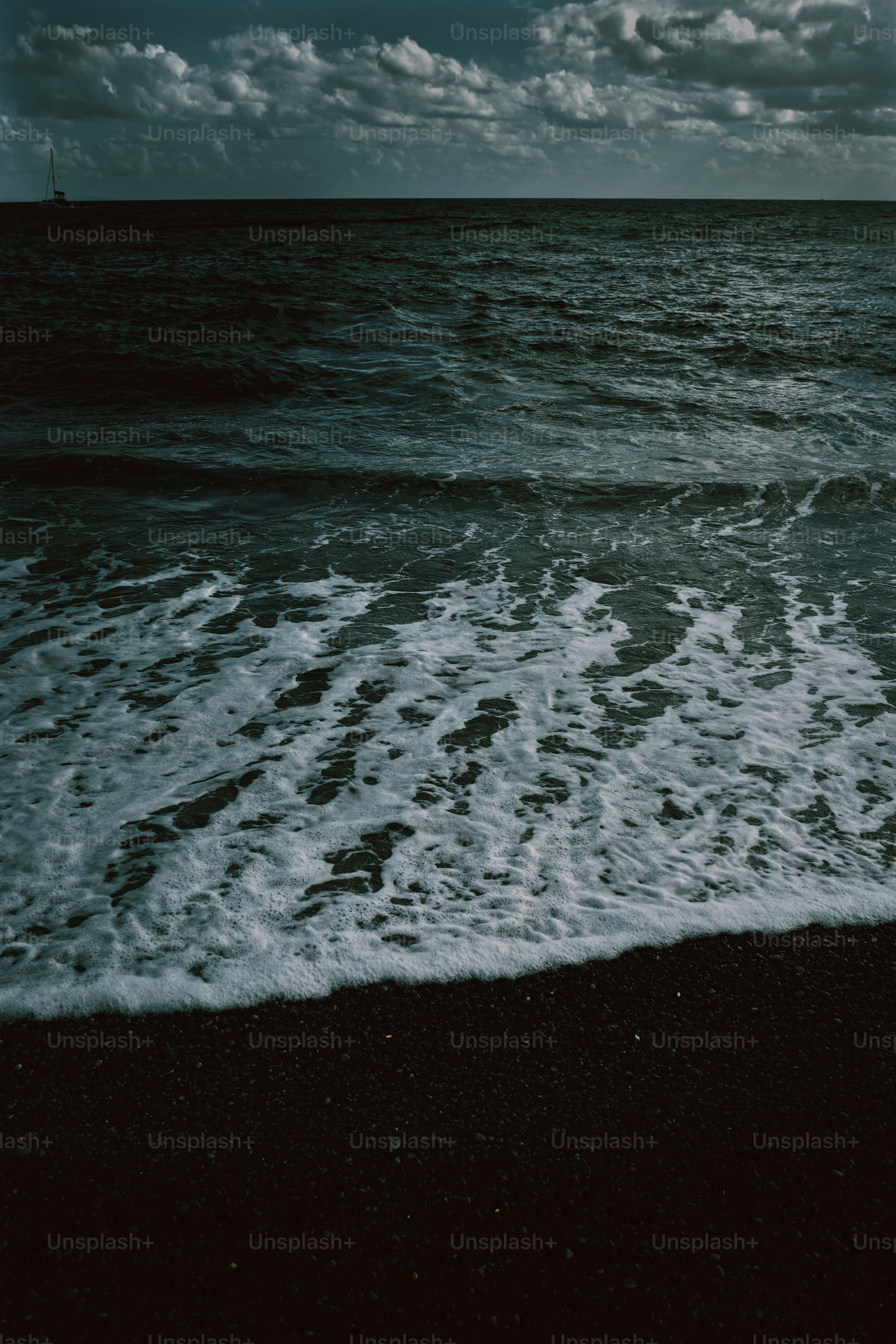 A black and white photo of the ocean