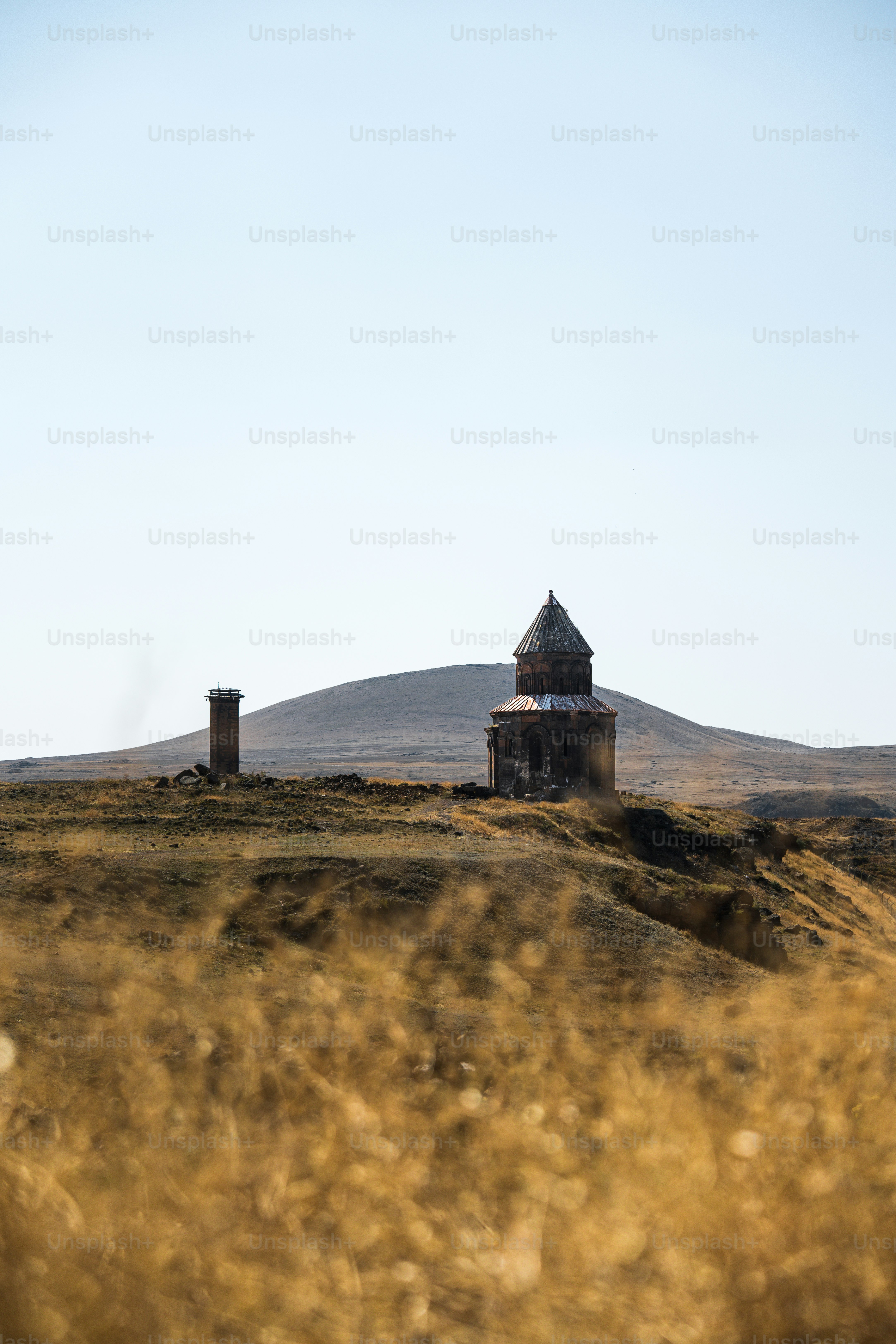 A small house sitting on top of a hill