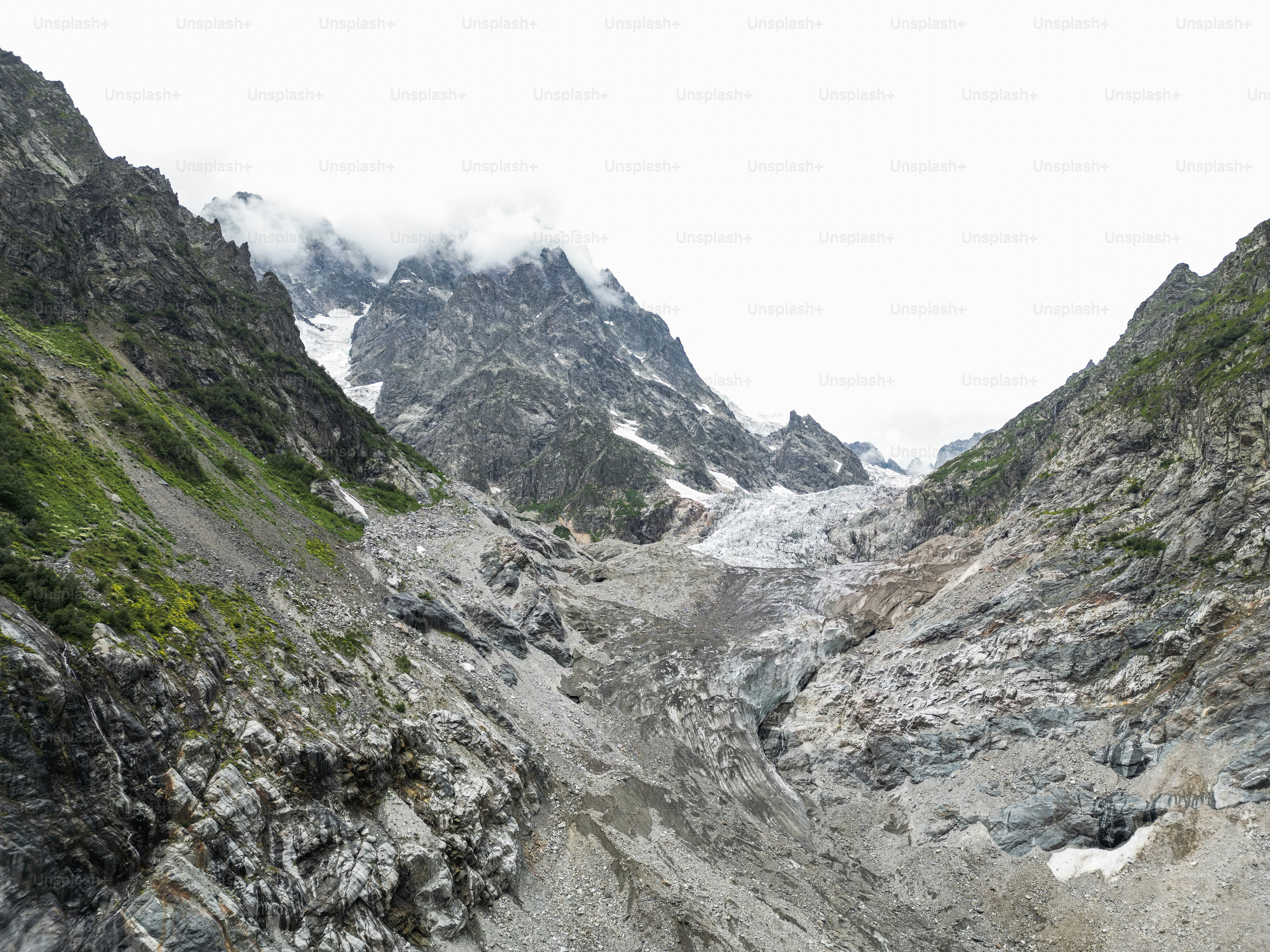 A group of people hiking up the side of a mountain