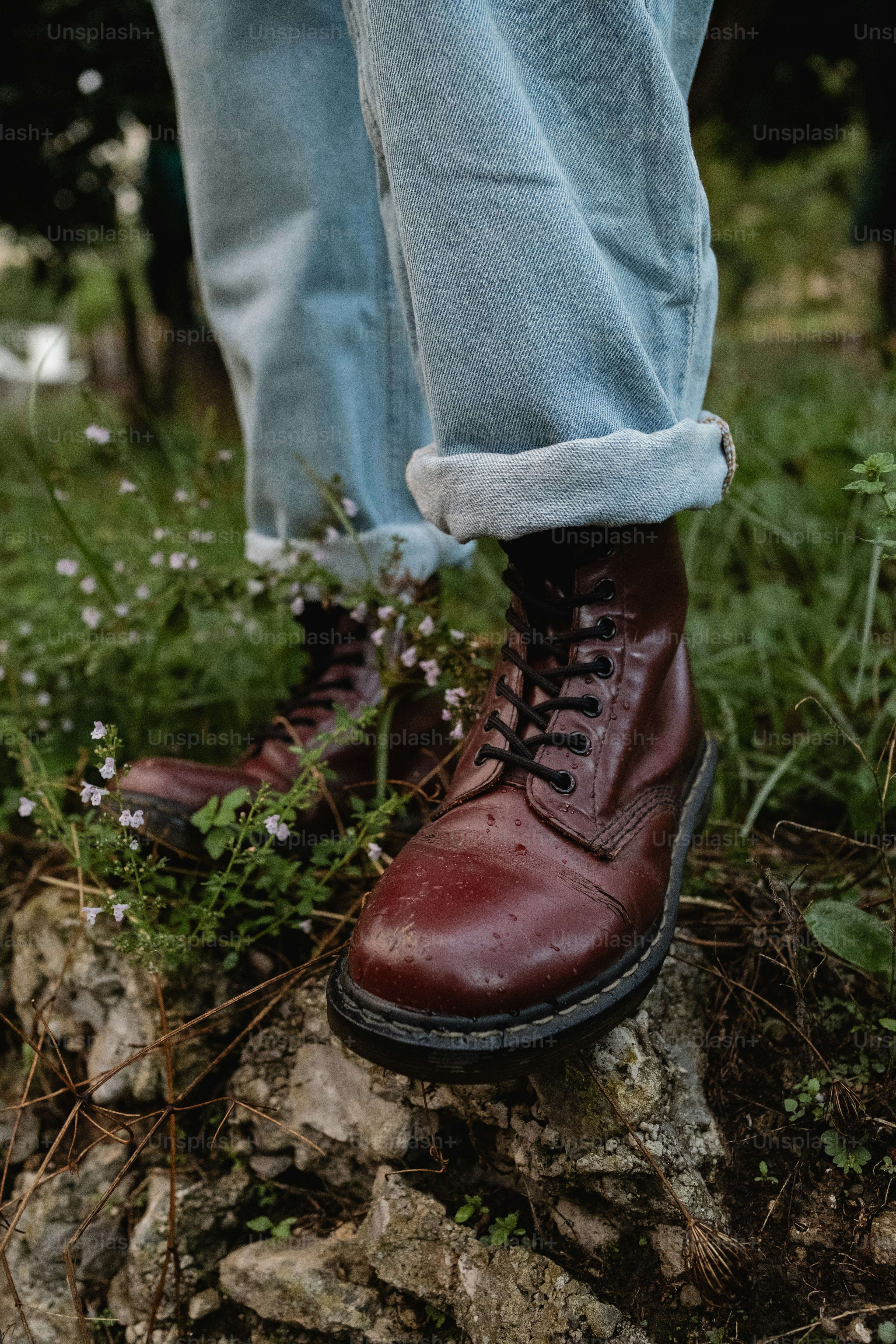 A person standing on top of a rock