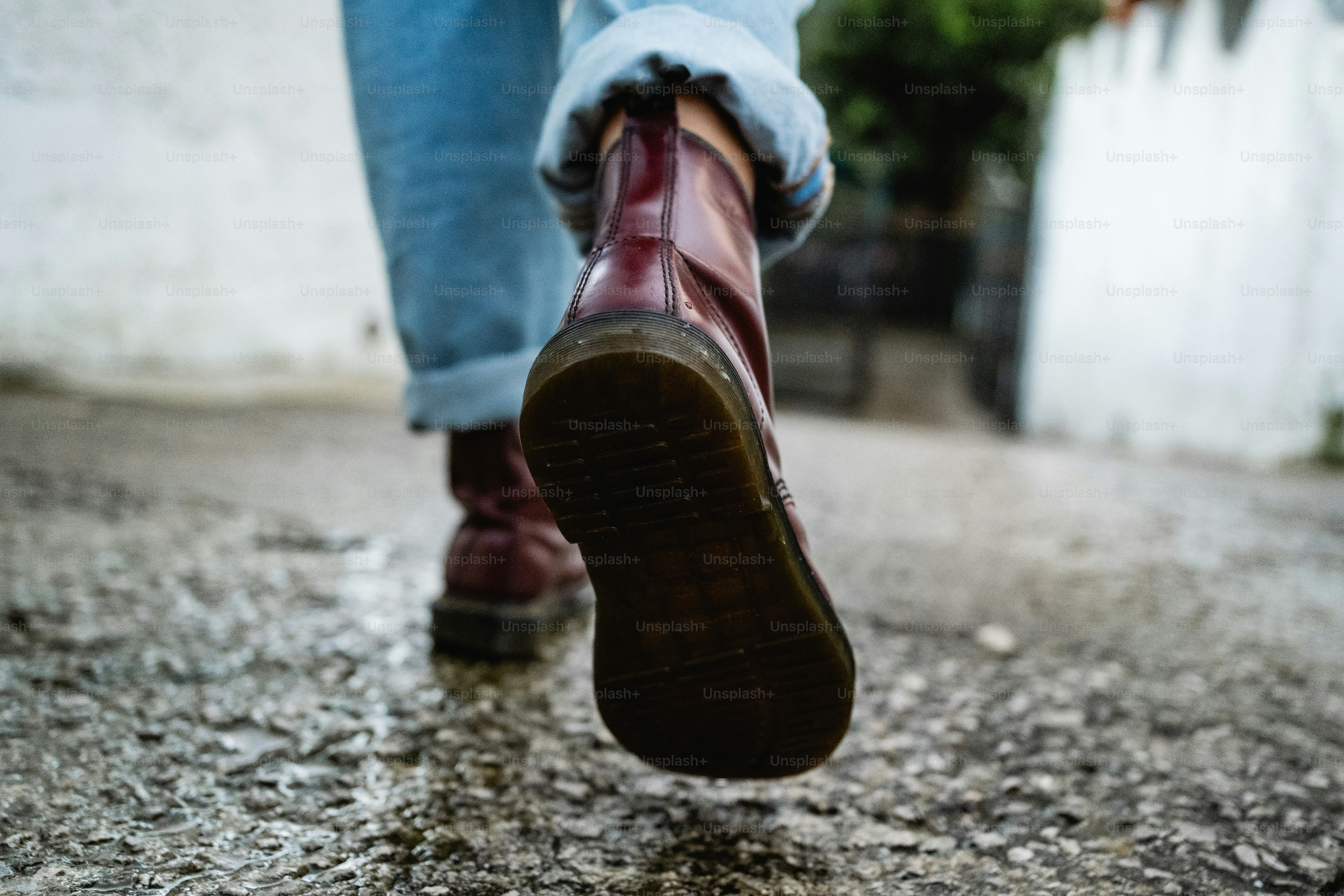 A person walking in the rain with their shoes on