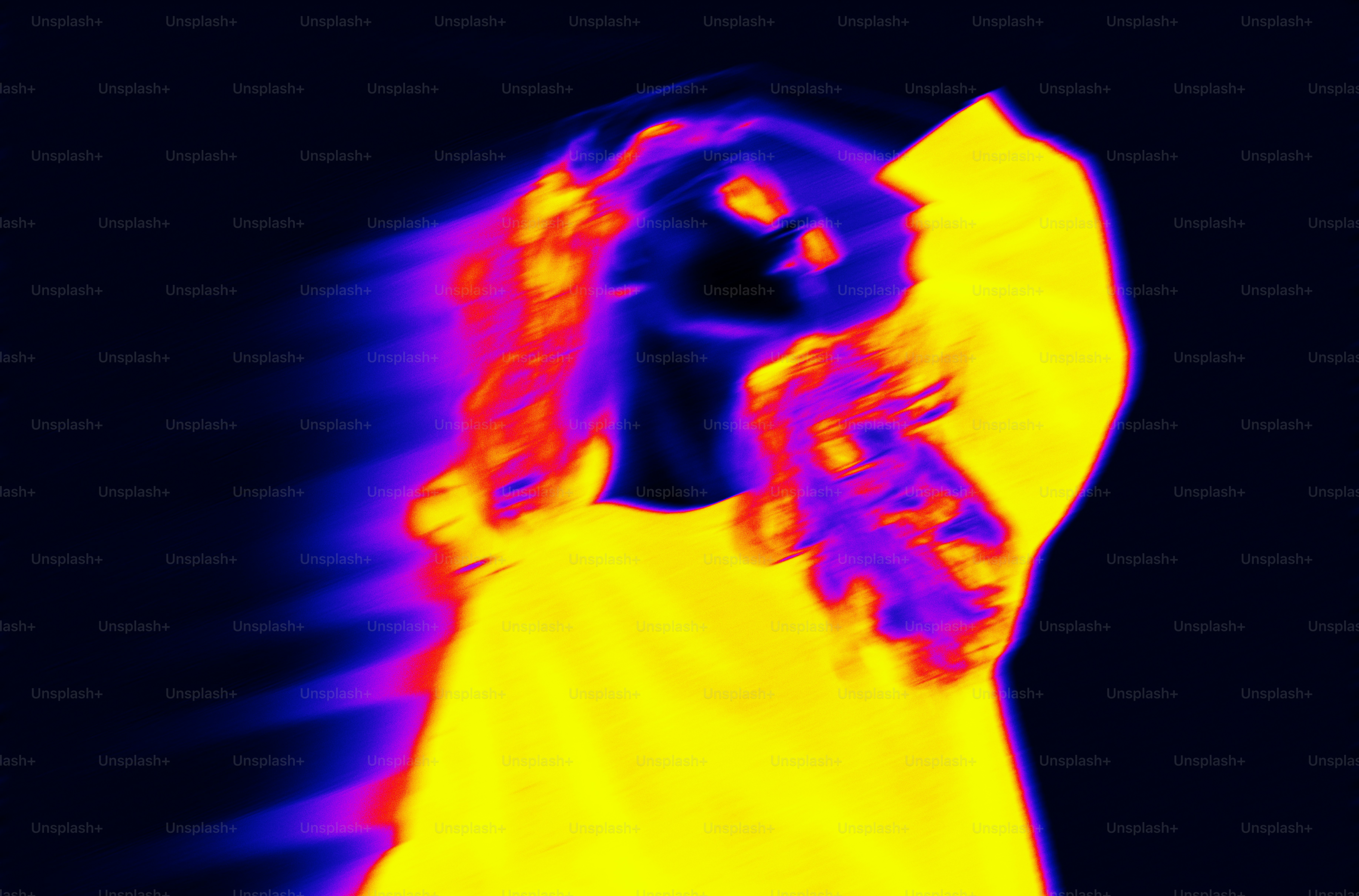 A woman in a yellow dress with a black background