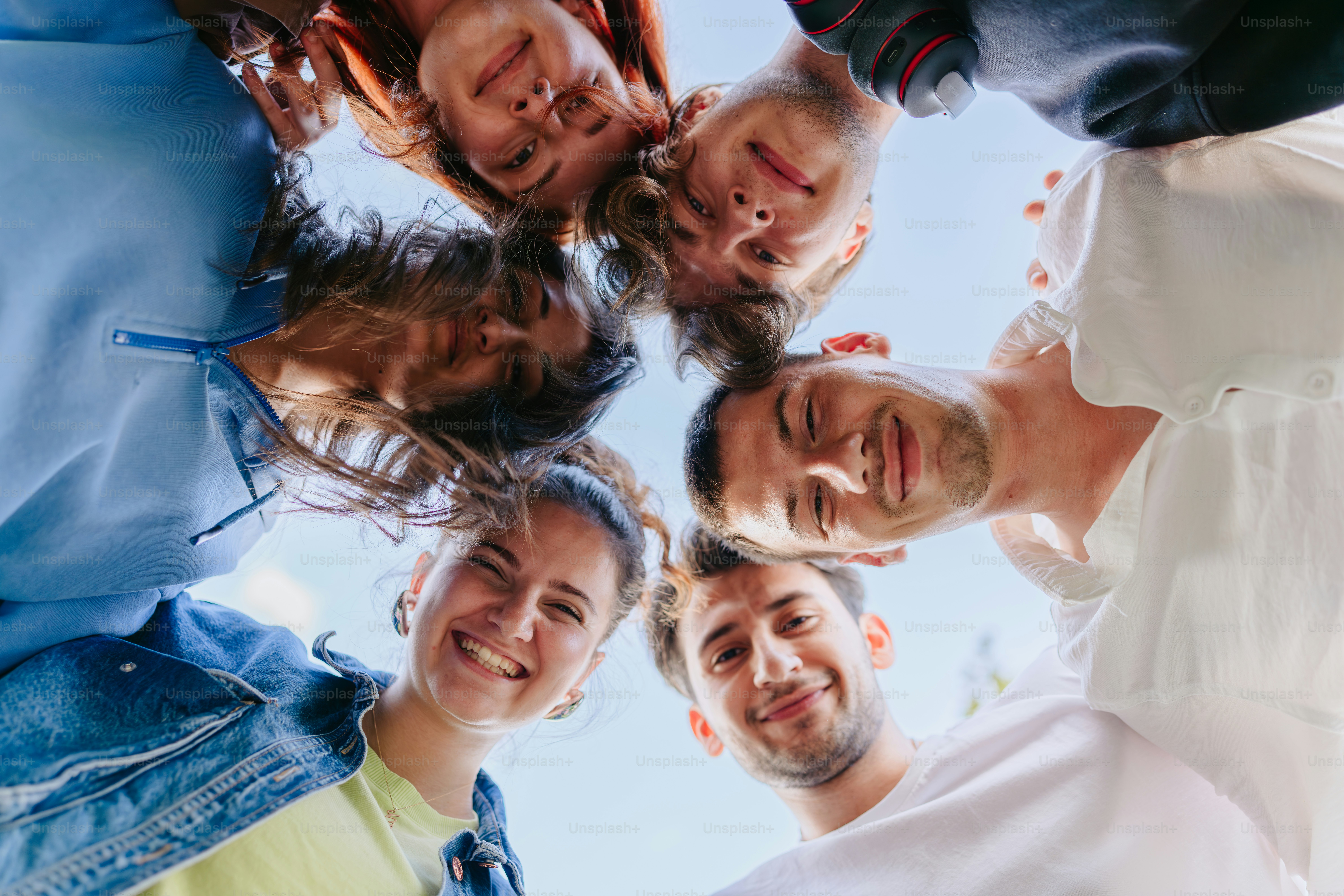 A group of young people posing for a picture photo – Blue Image on Unsplash