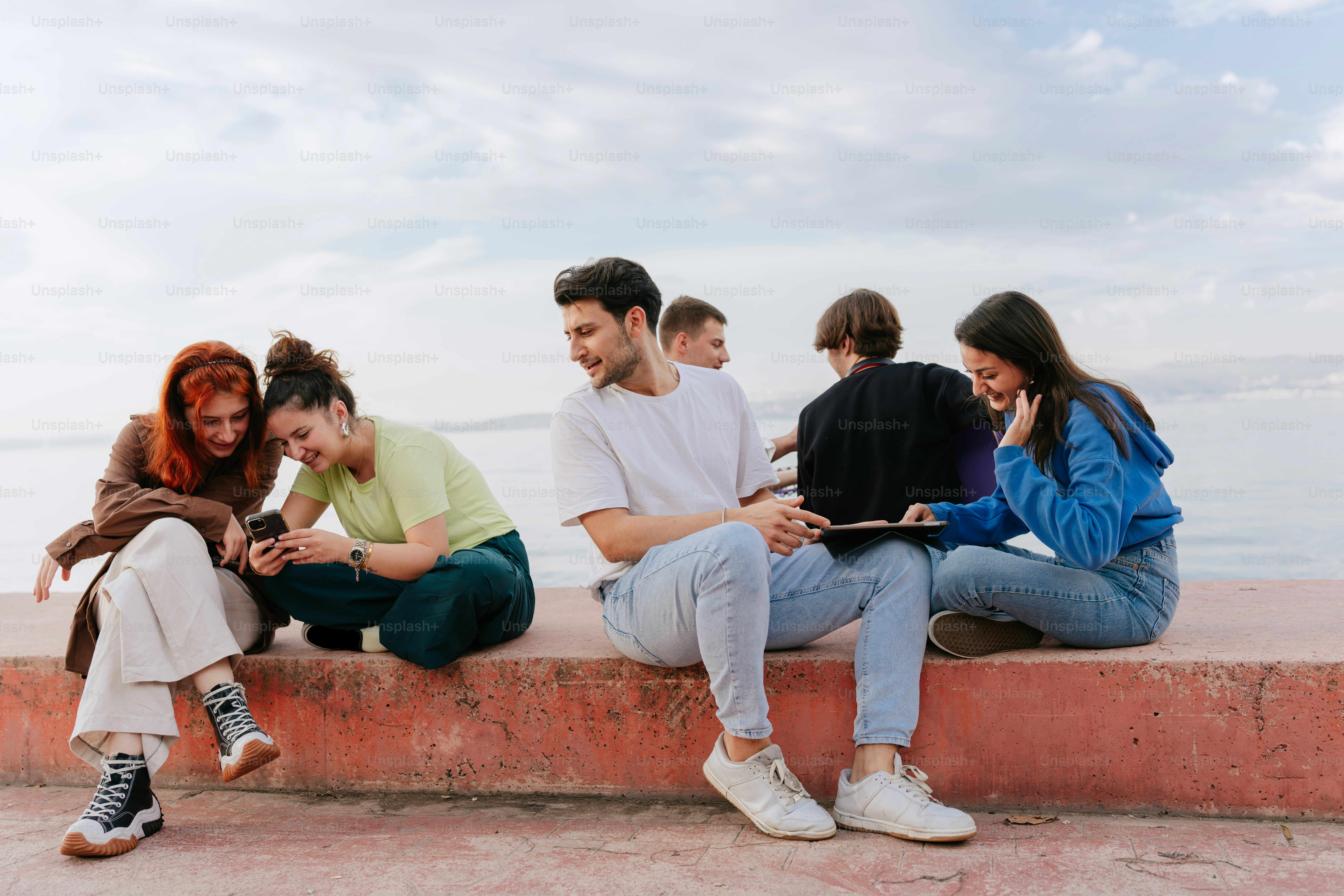 A group of people sitting next to each other