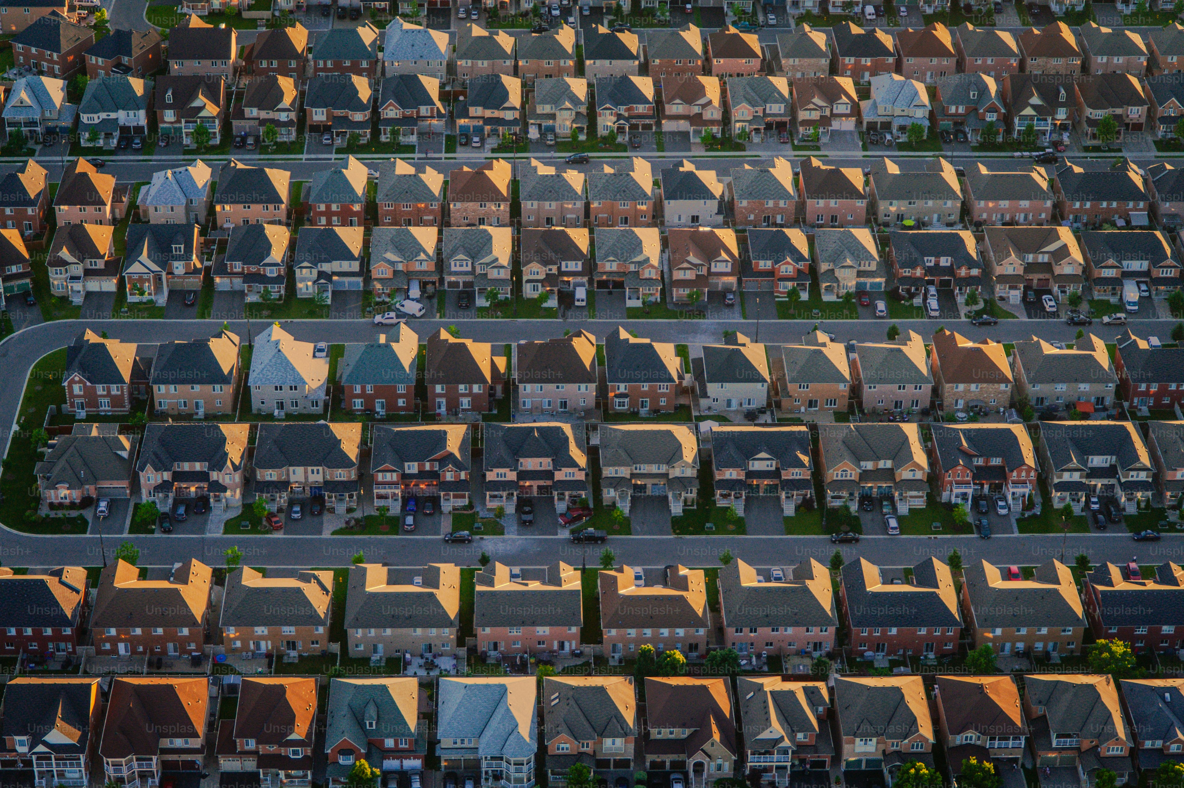 An aerial view of a neighborhood at sunset