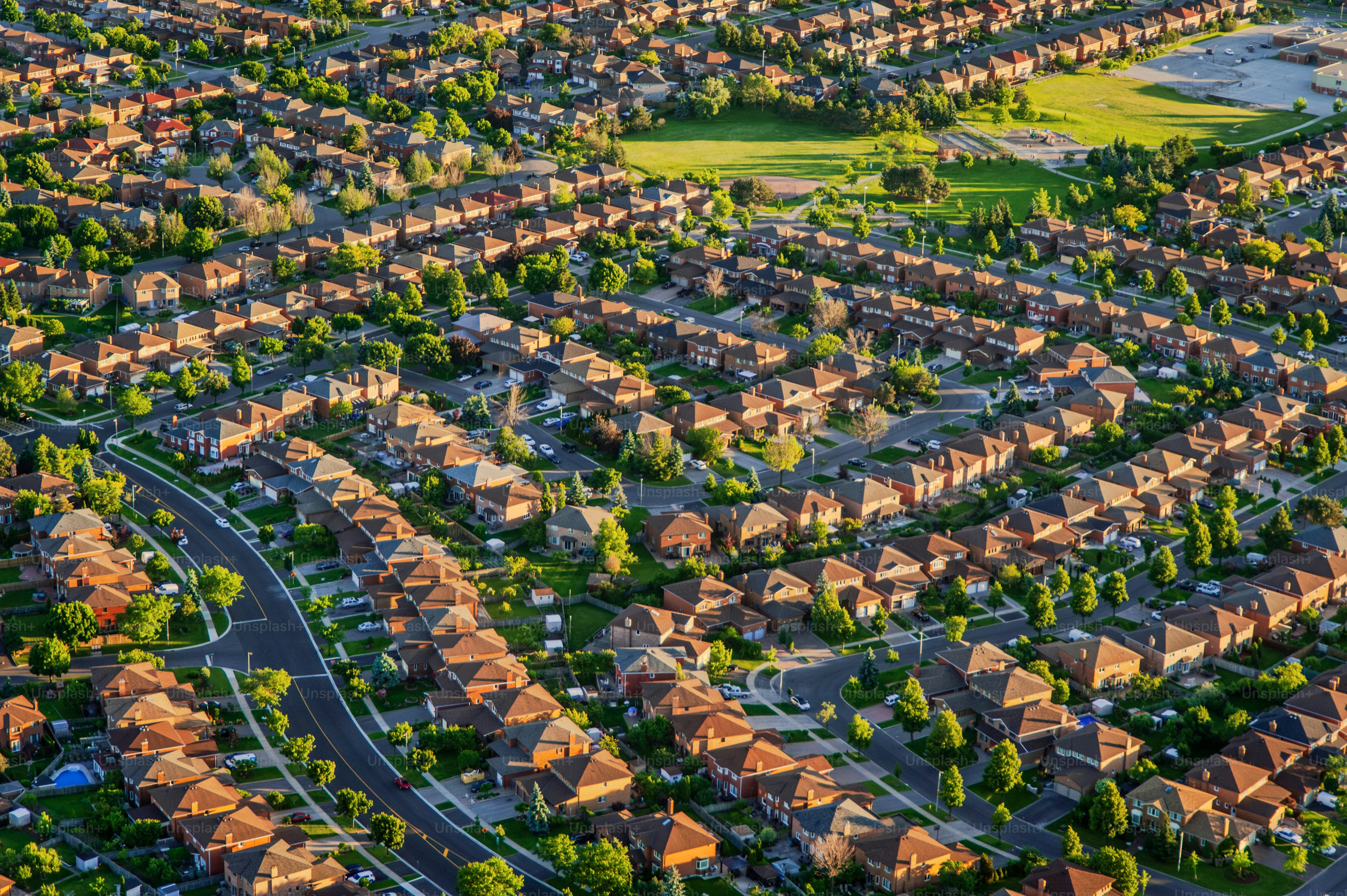 An aerial view of a city with lots of houses
