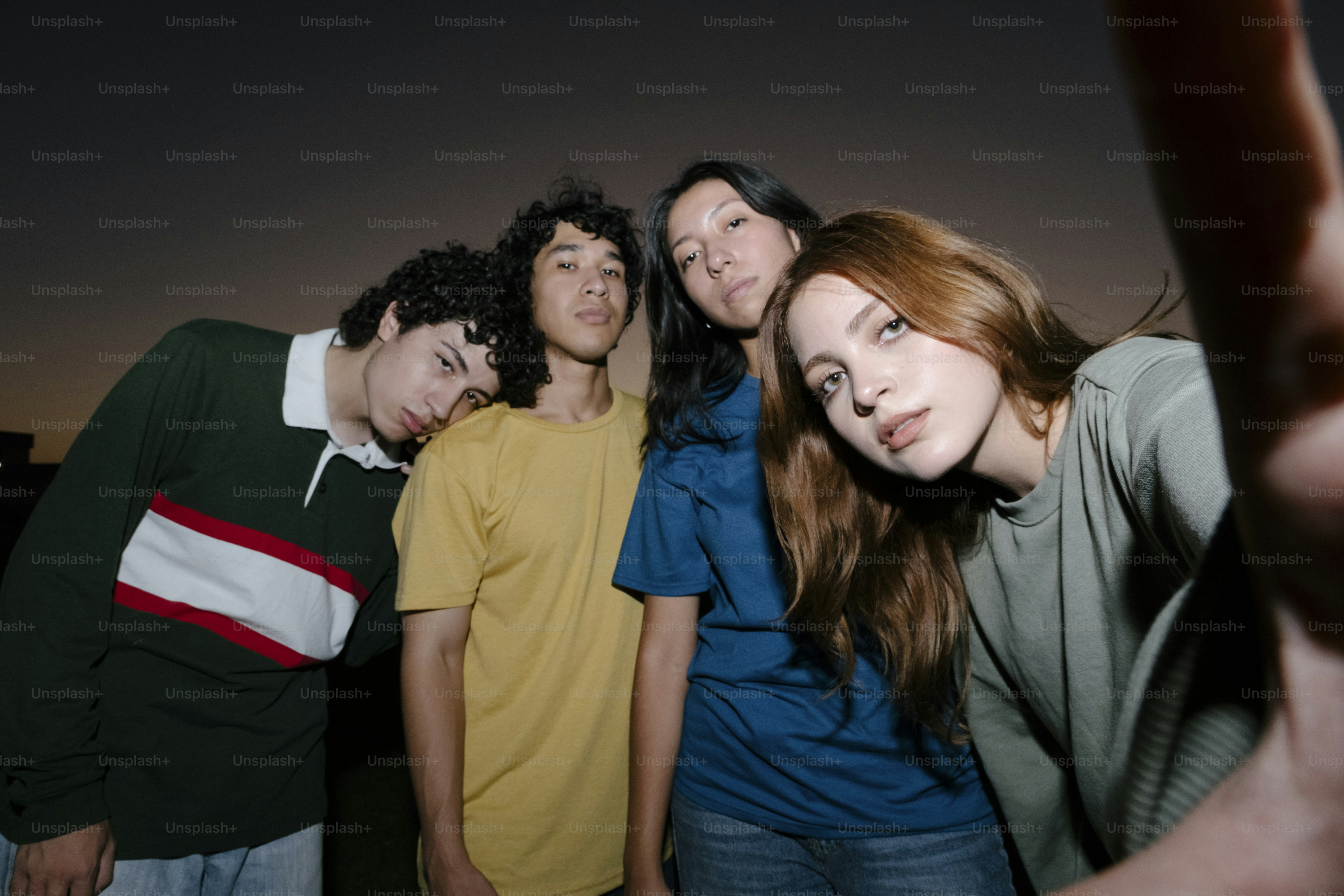 A group of young people standing next to each other