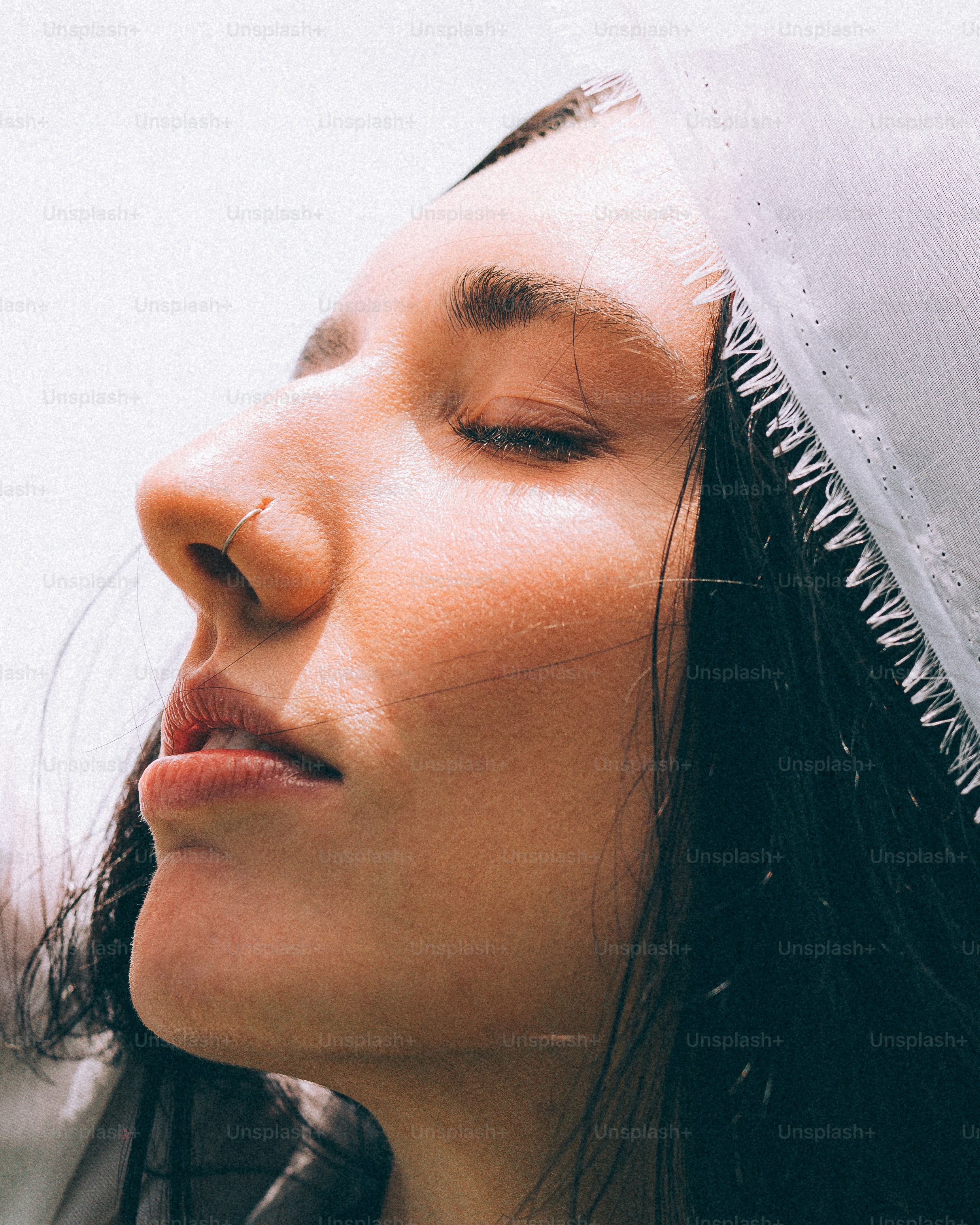 A woman with a veil on her head