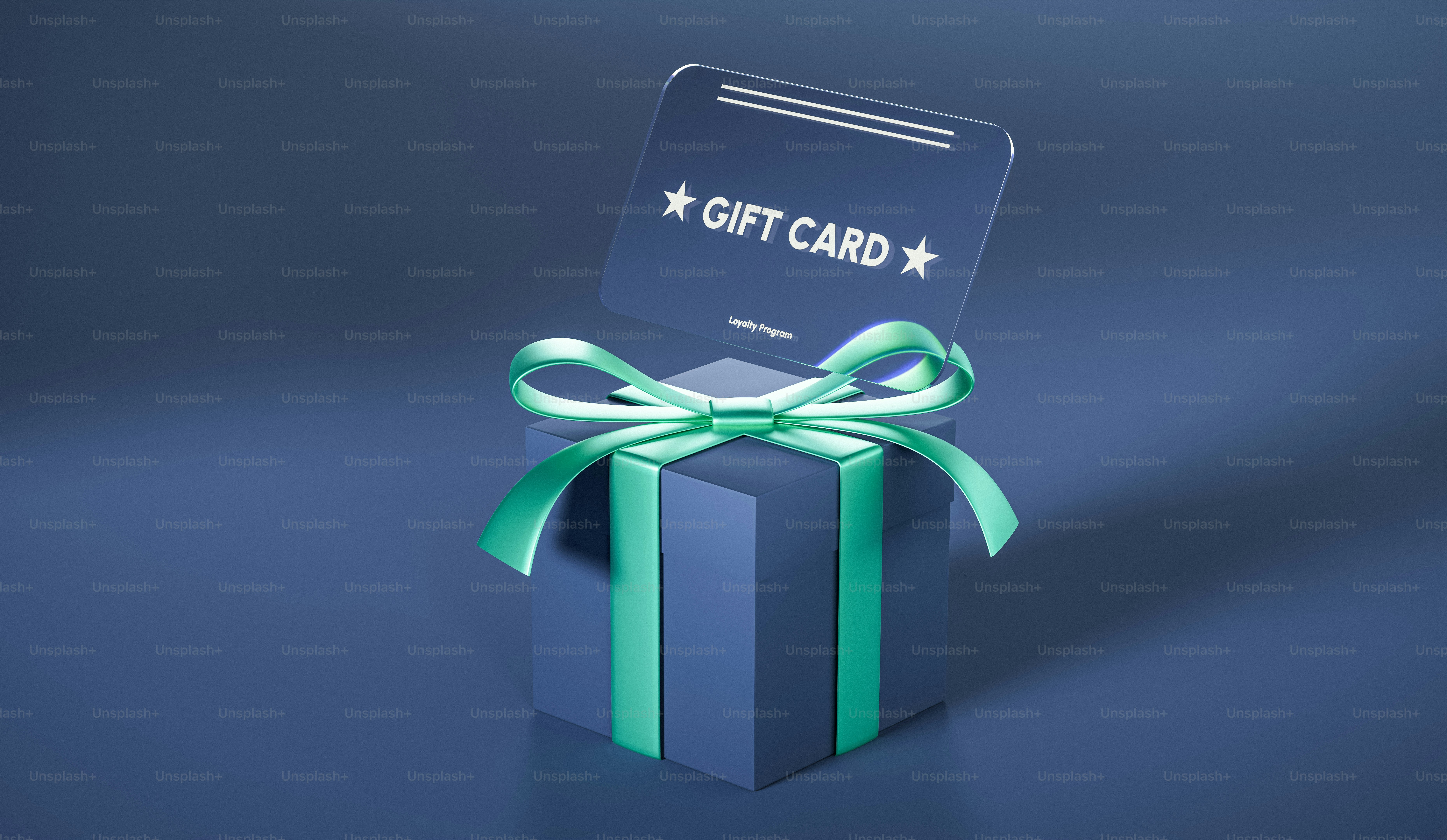 A blue gift box with a green ribbon