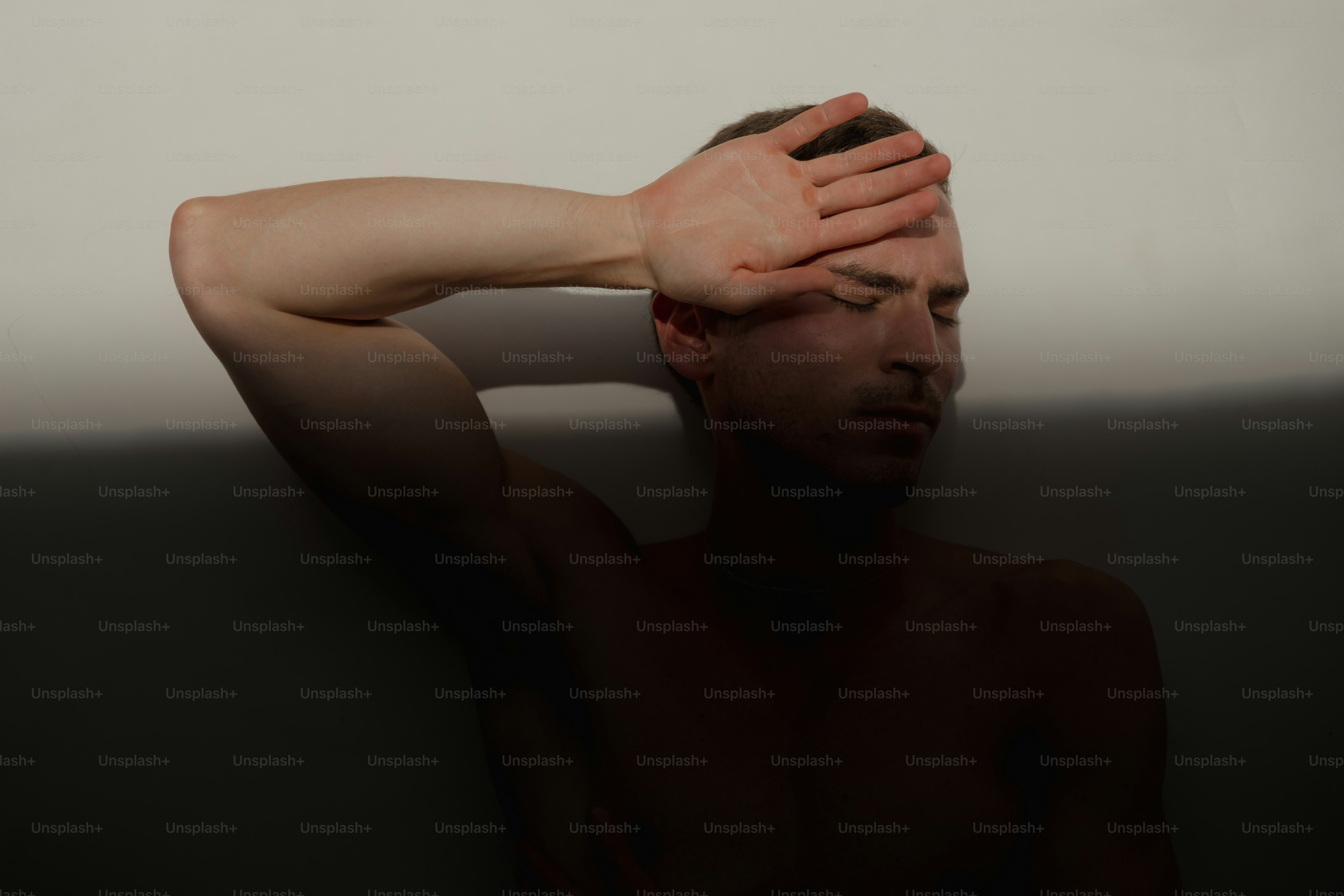 A man with his hands on his head