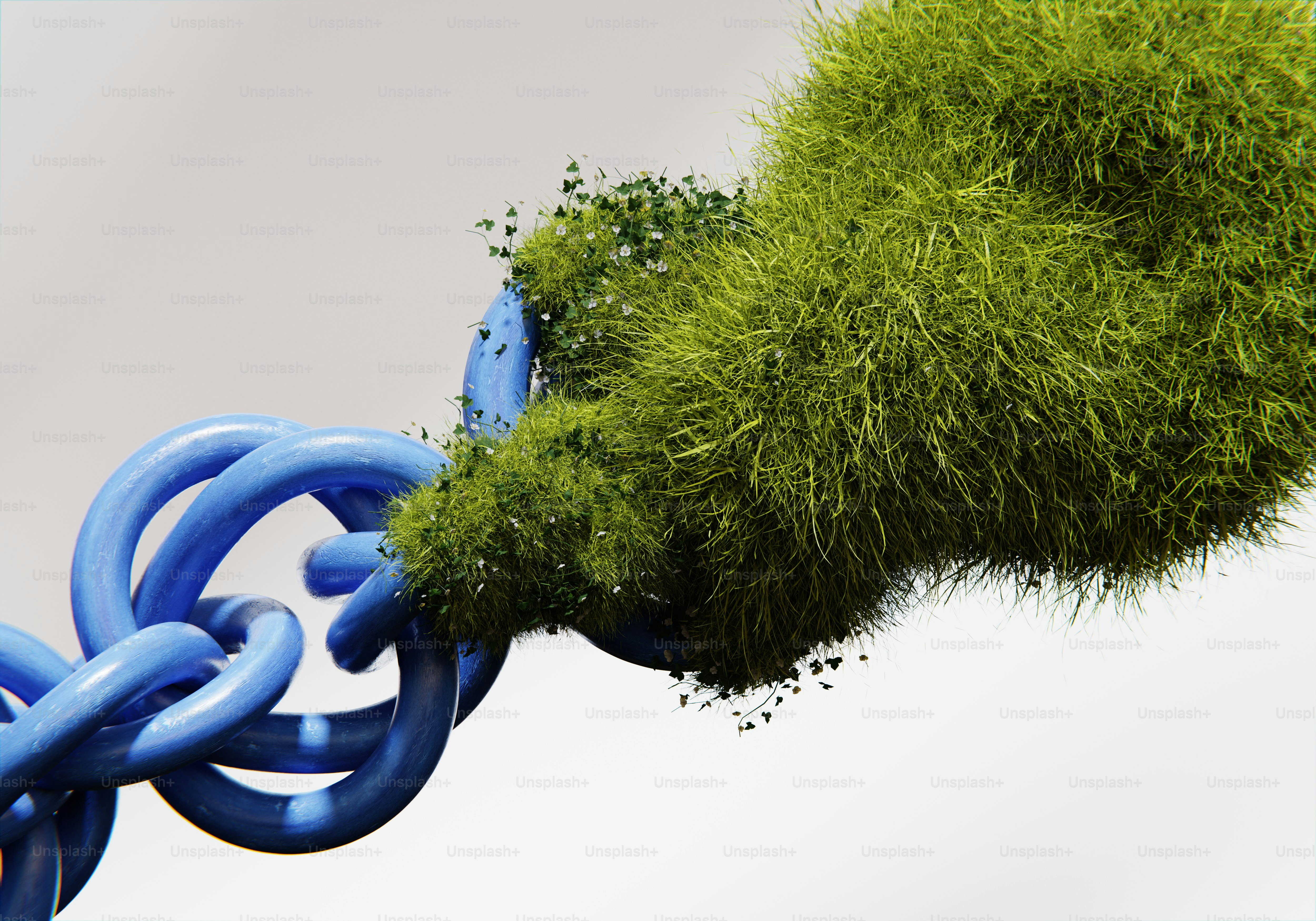 A green ball of grass being held by a blue chain
