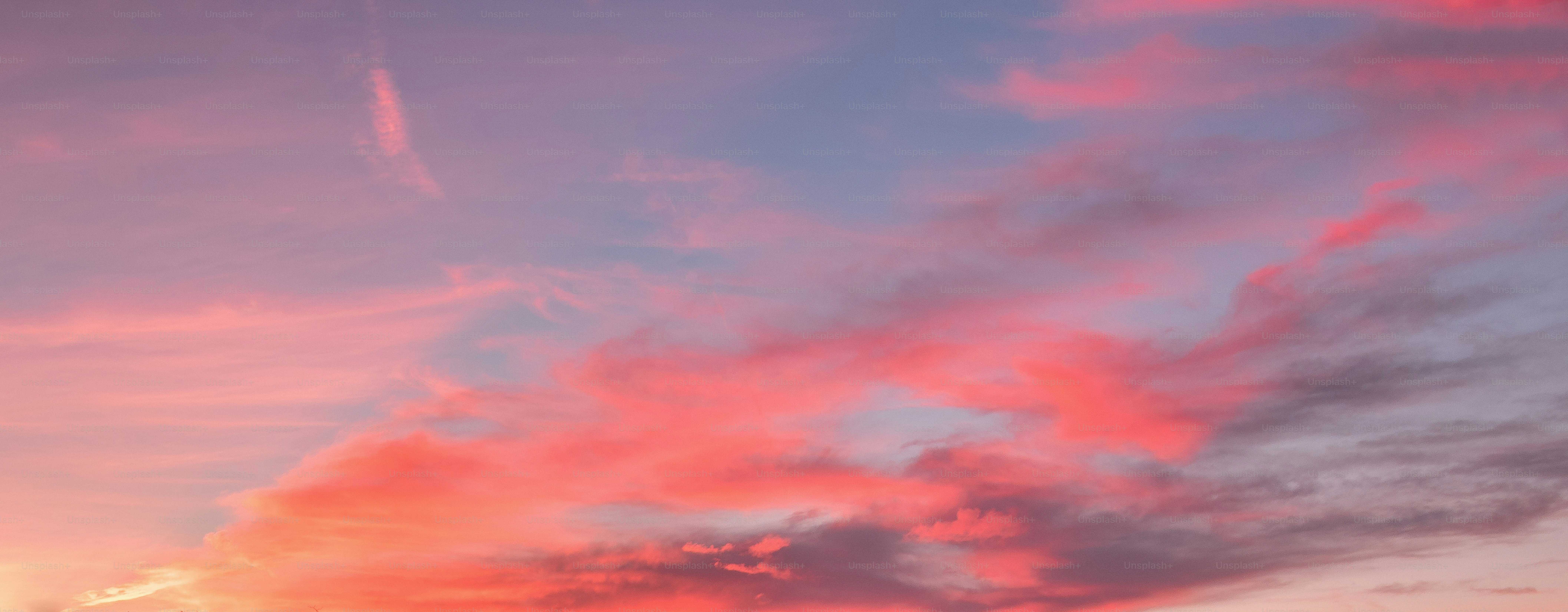 The sky is pink and blue as the sun sets