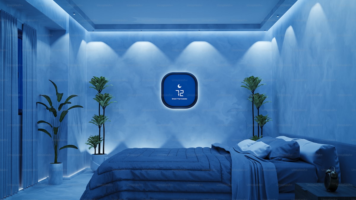 A bed room with a neatly made bed and a skylight