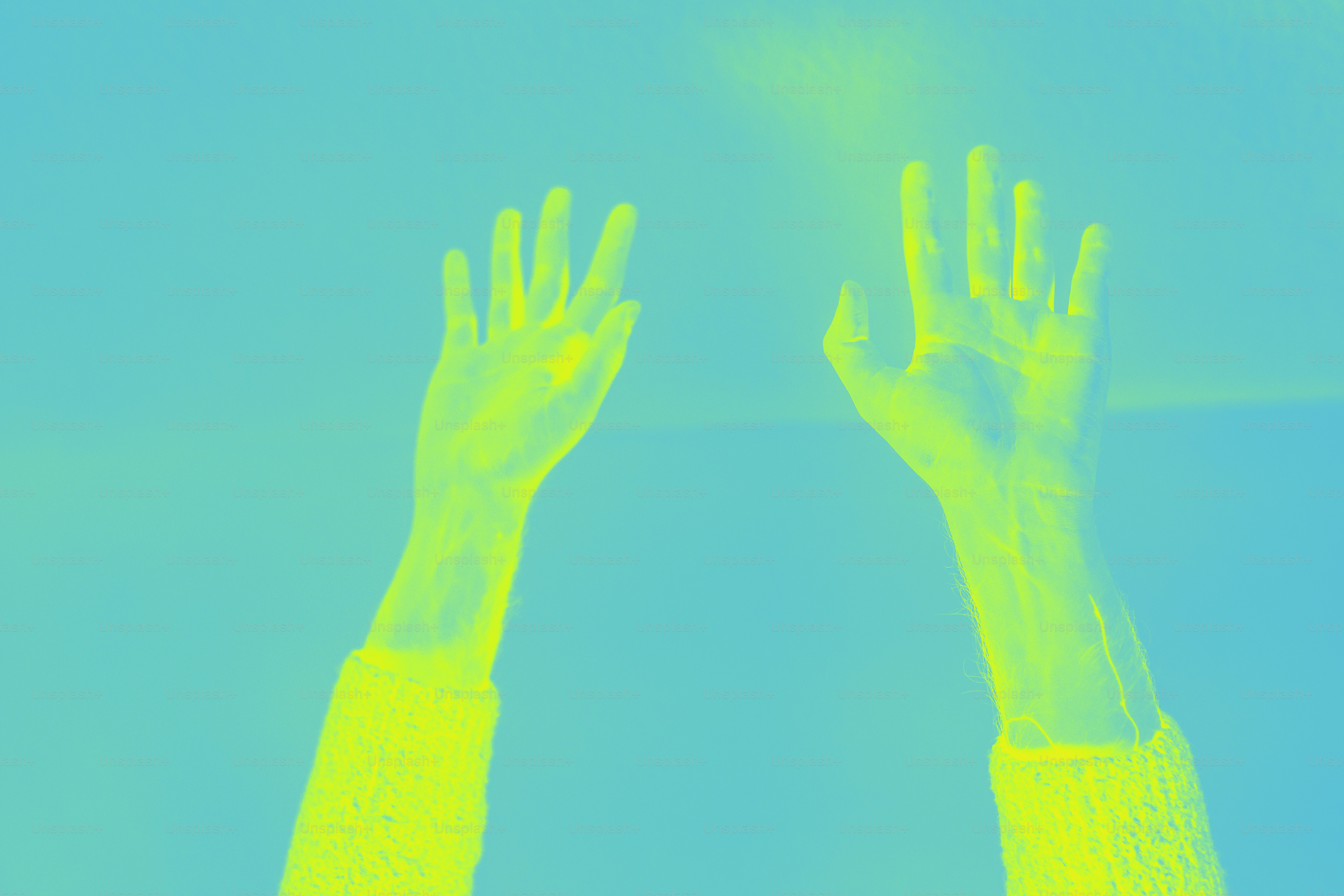 Two hands reaching up into the sky