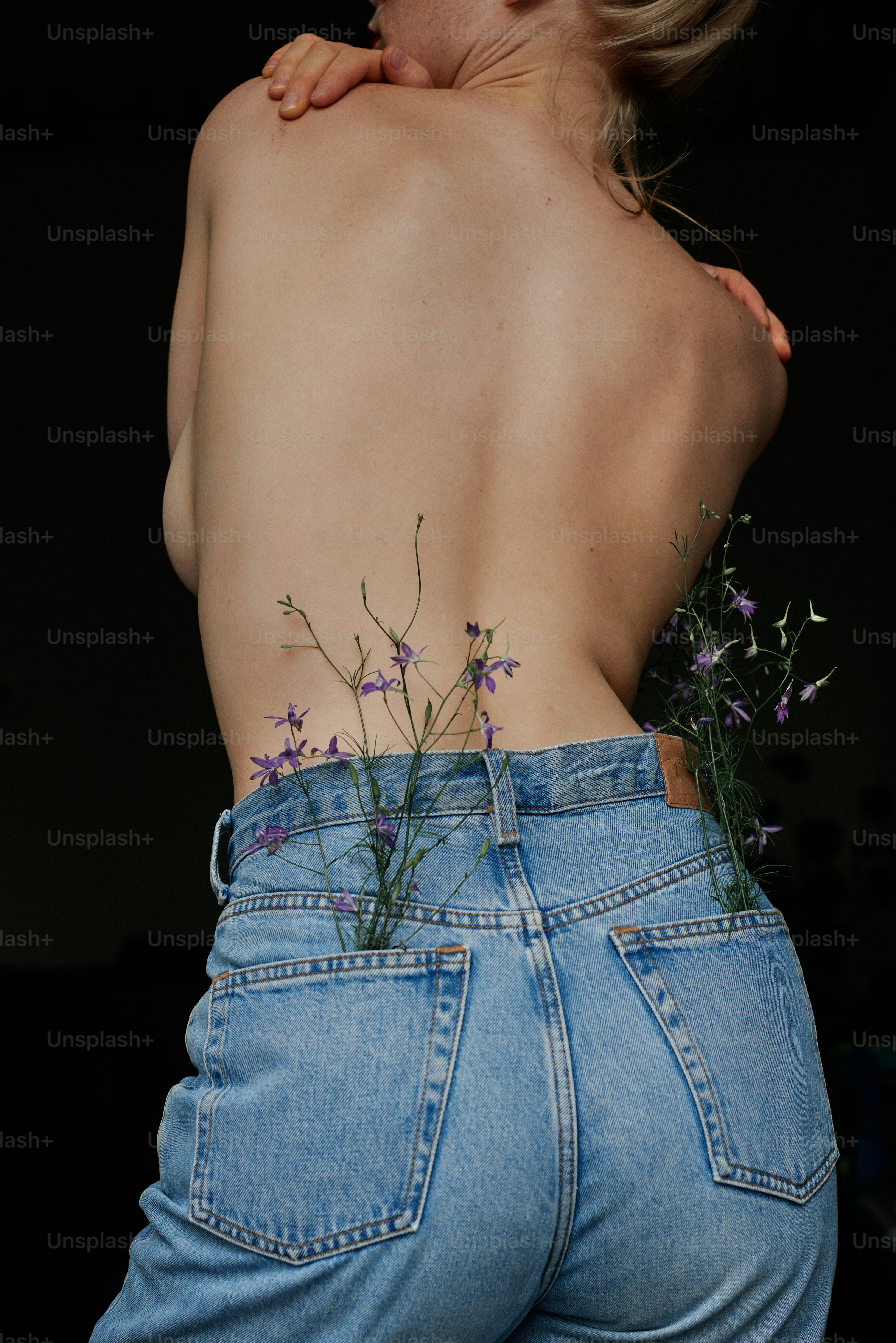 A woman with a flower tattoo on her back