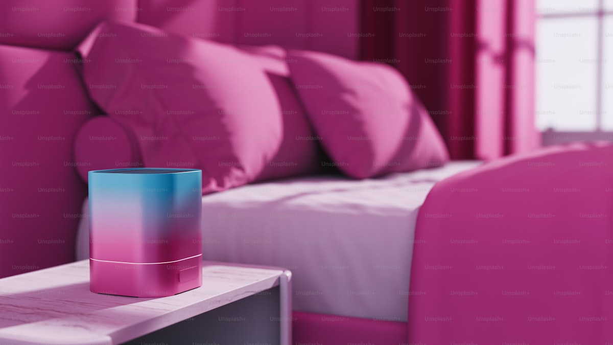 A bedroom with pink walls and a bed with a pink headboard