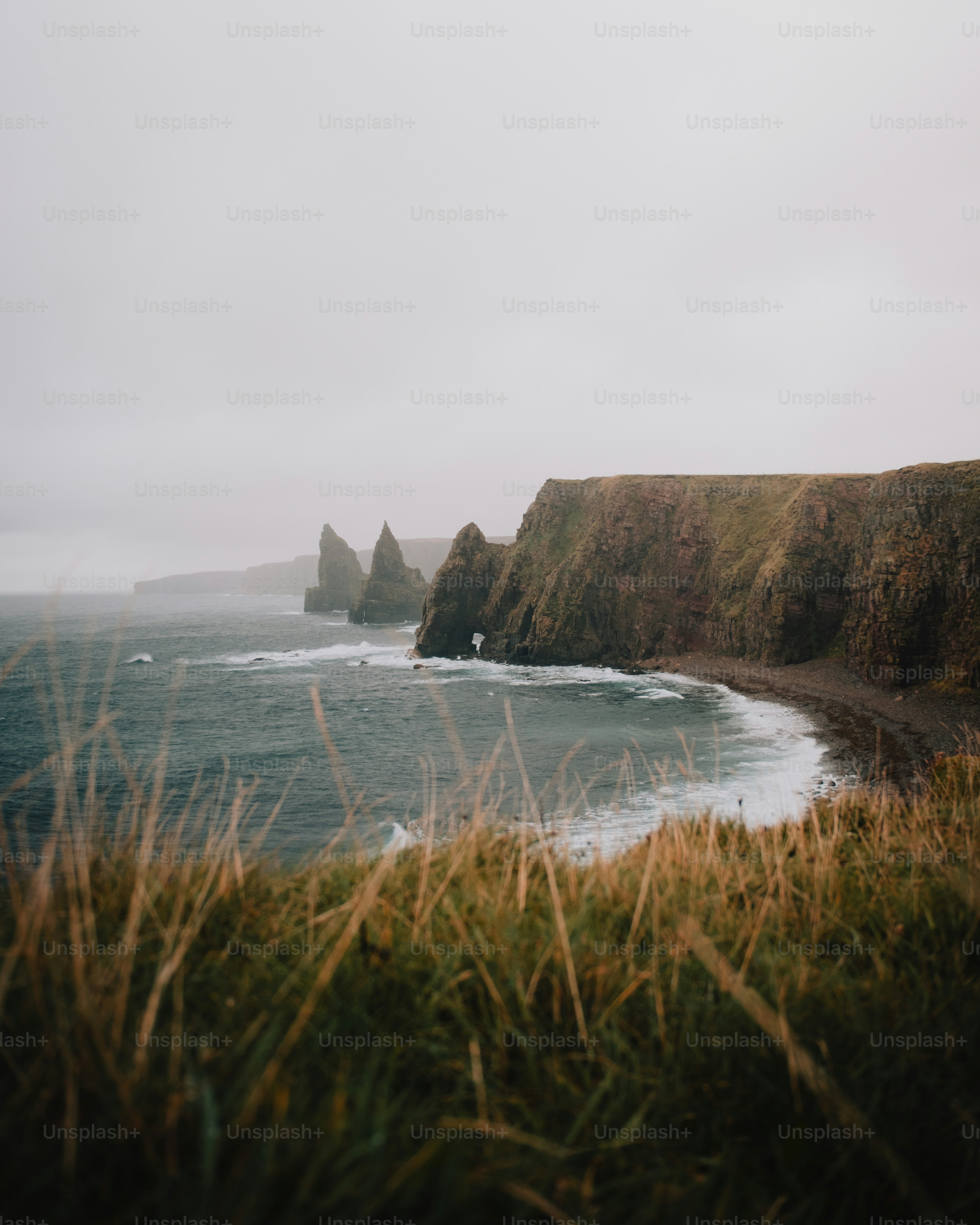 A view of a body of water with cliffs in the background