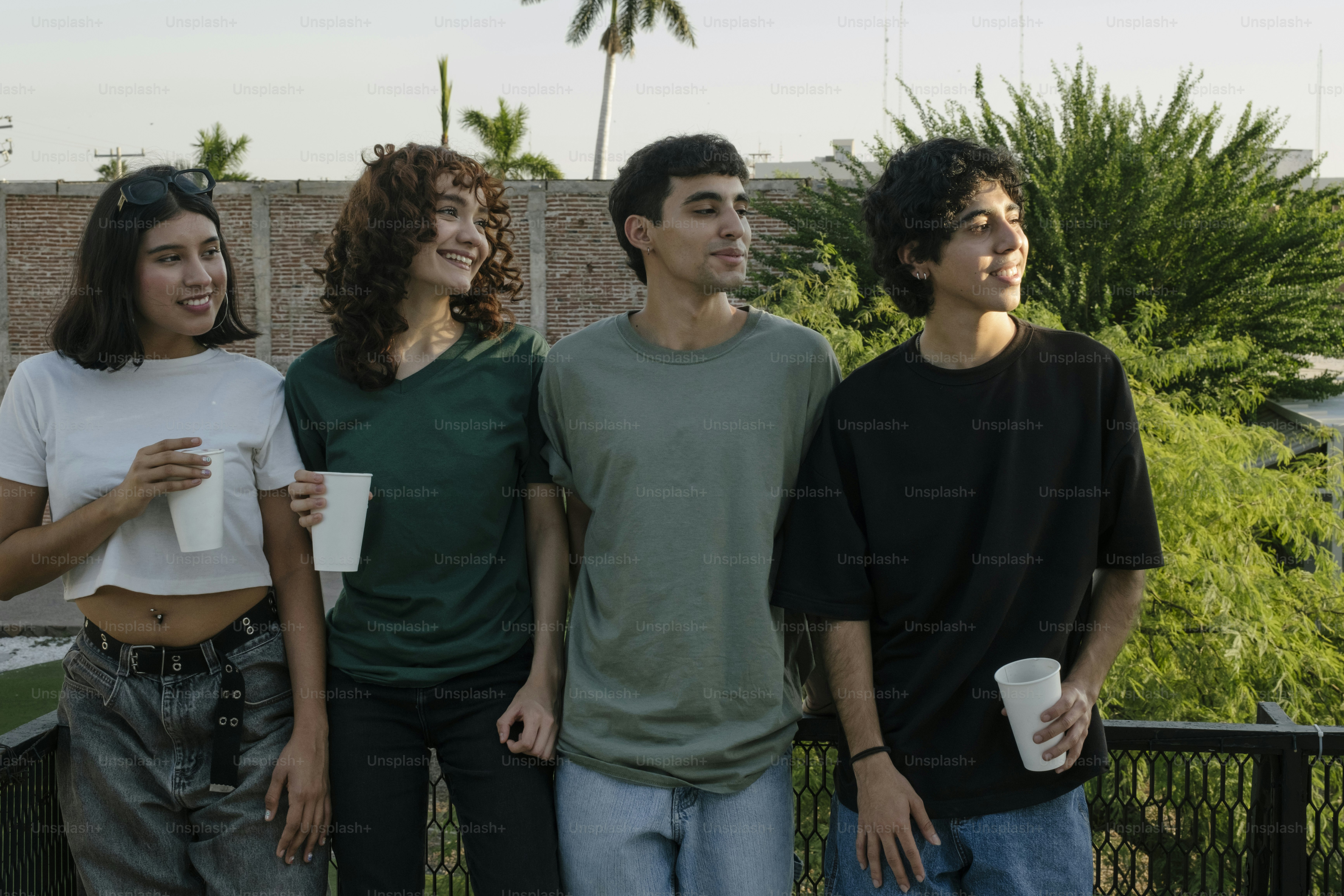 A group of young people standing next to each other