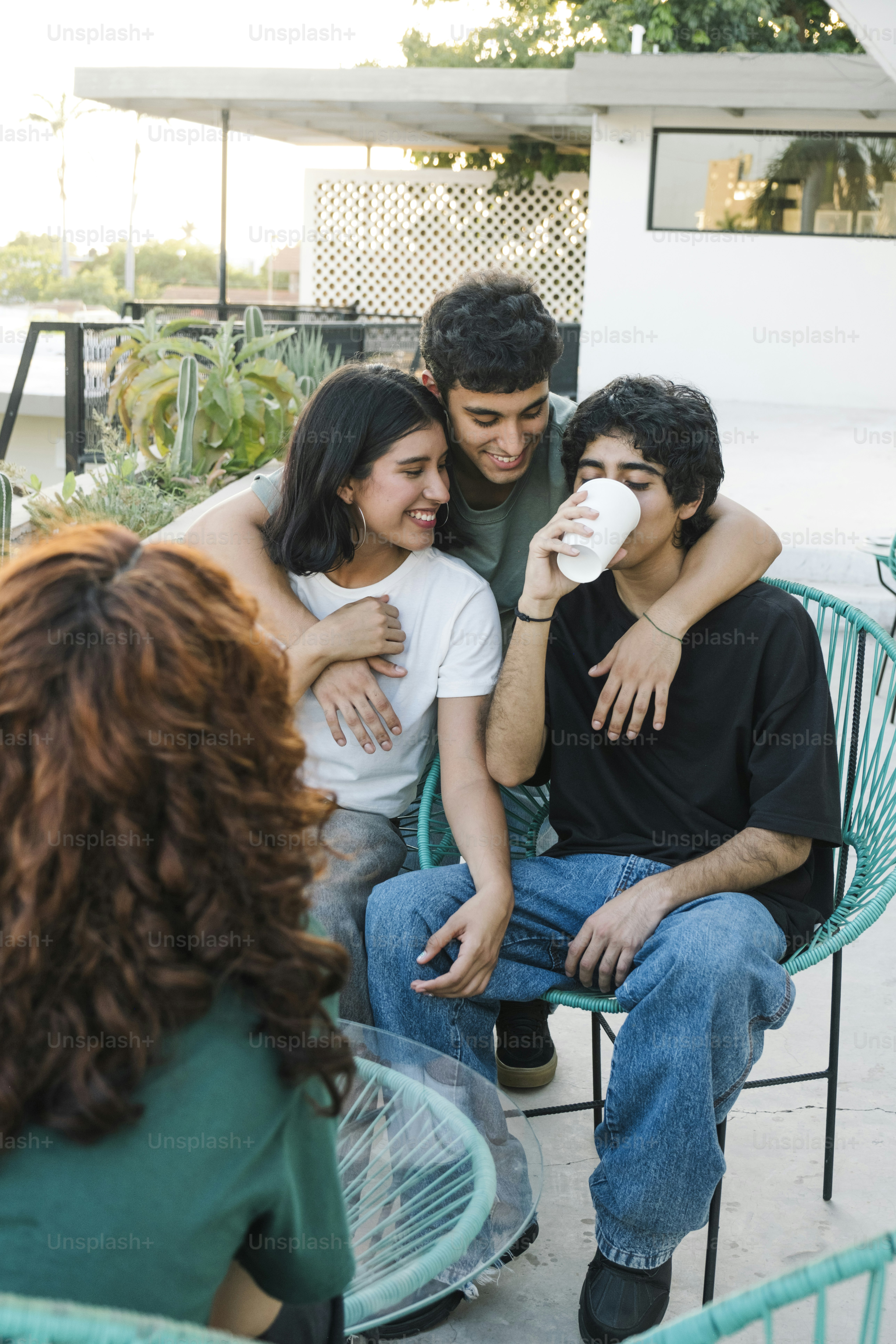 A group of people sitting around each other